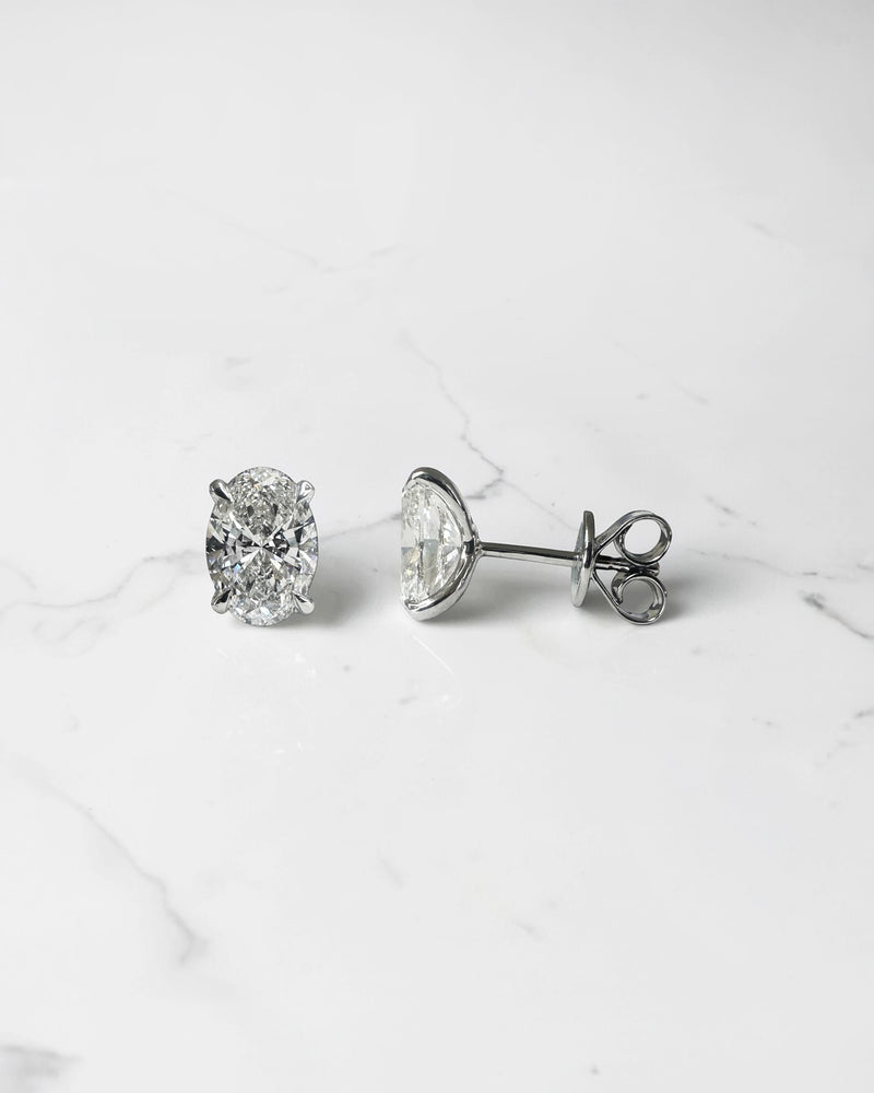 3ct lab grown oval diamond stud earrings featuring two 1.50ct oval brilliant cut diamonds in a classic four prong setting.