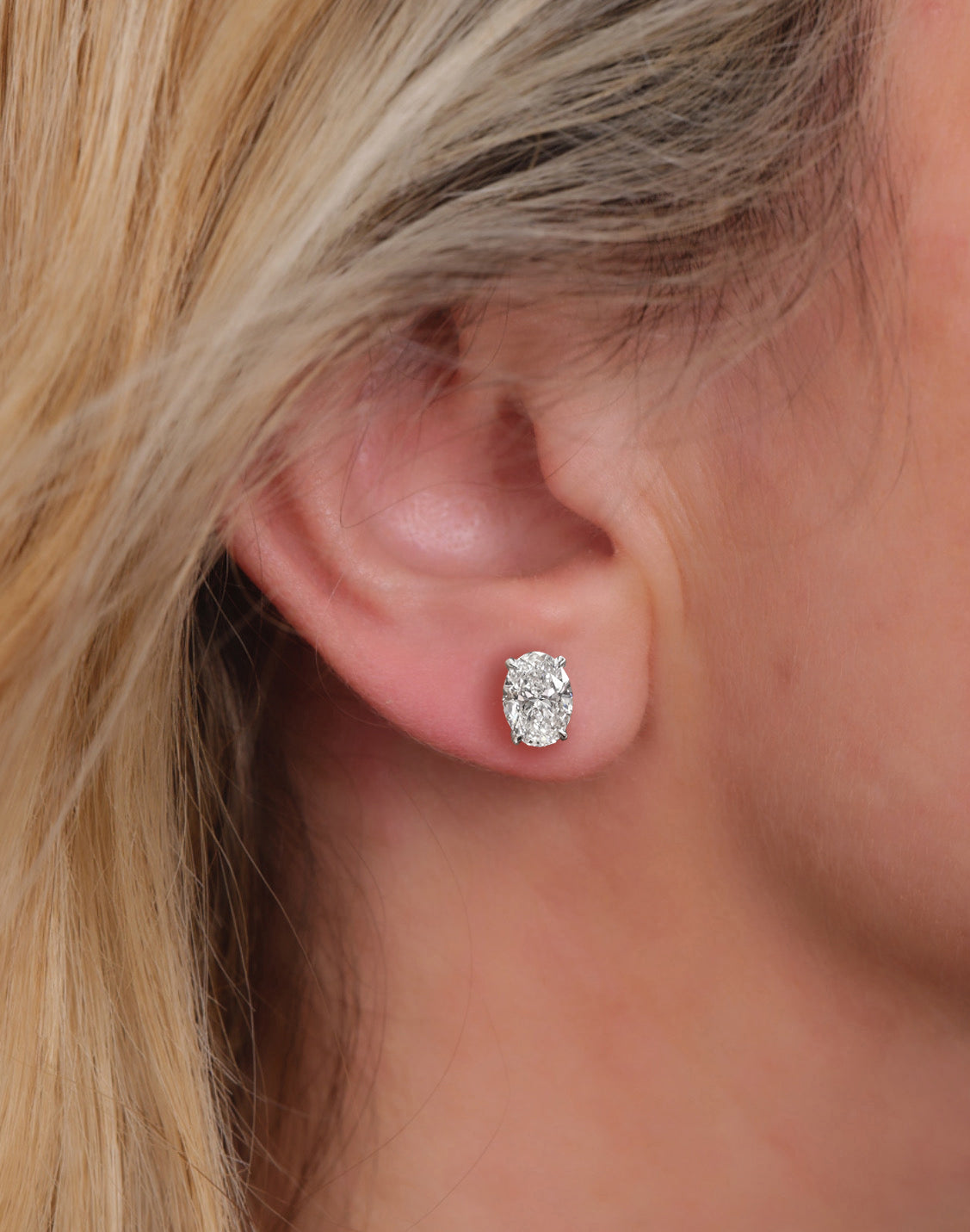 3ct lab grown oval diamond stud earrings featuring two 1.50ct oval brilliant cut diamonds in a classic four prong setting.