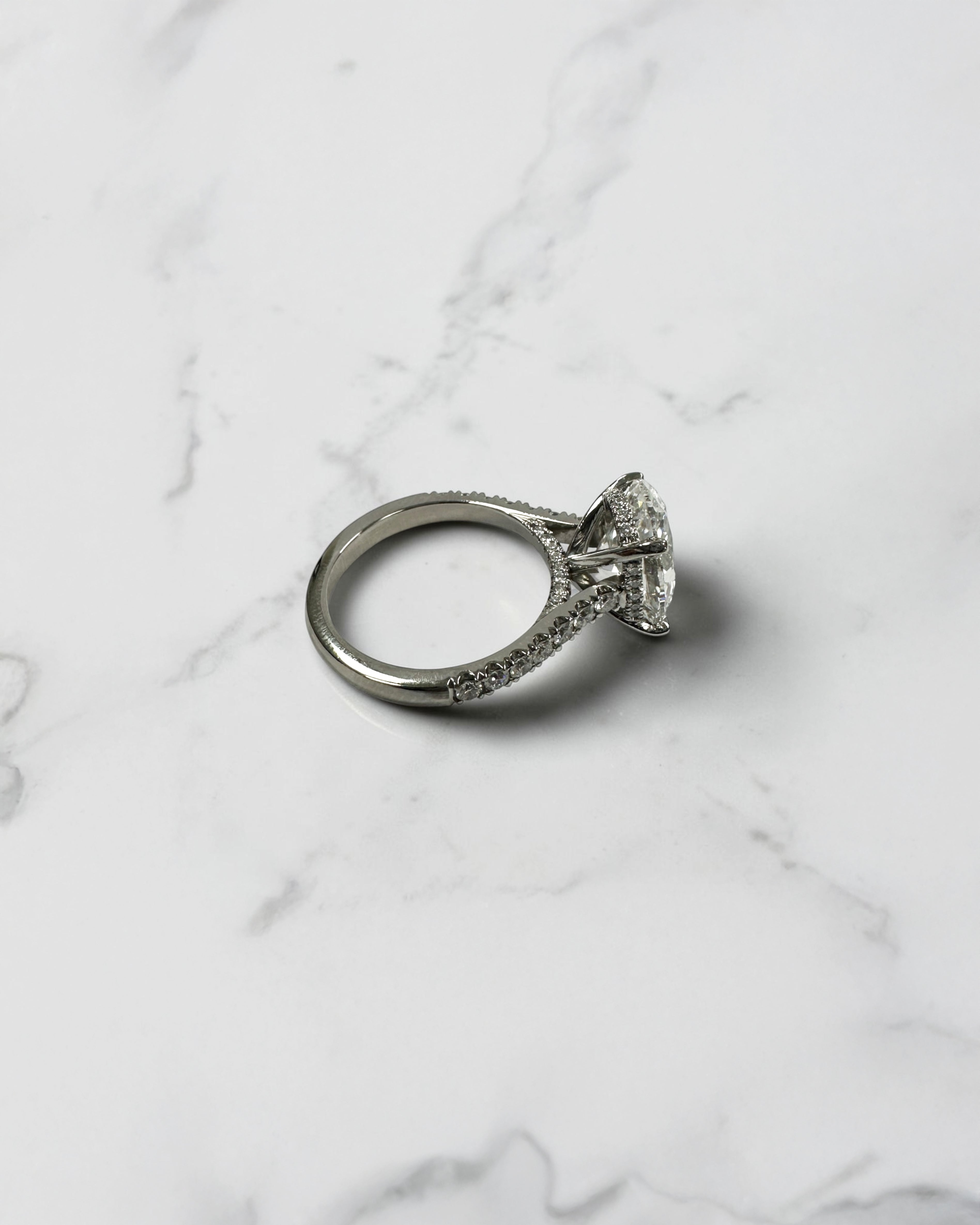 3ct Oval cut Cathedral Setting lab grown diamond engagement ring in platinum on hand