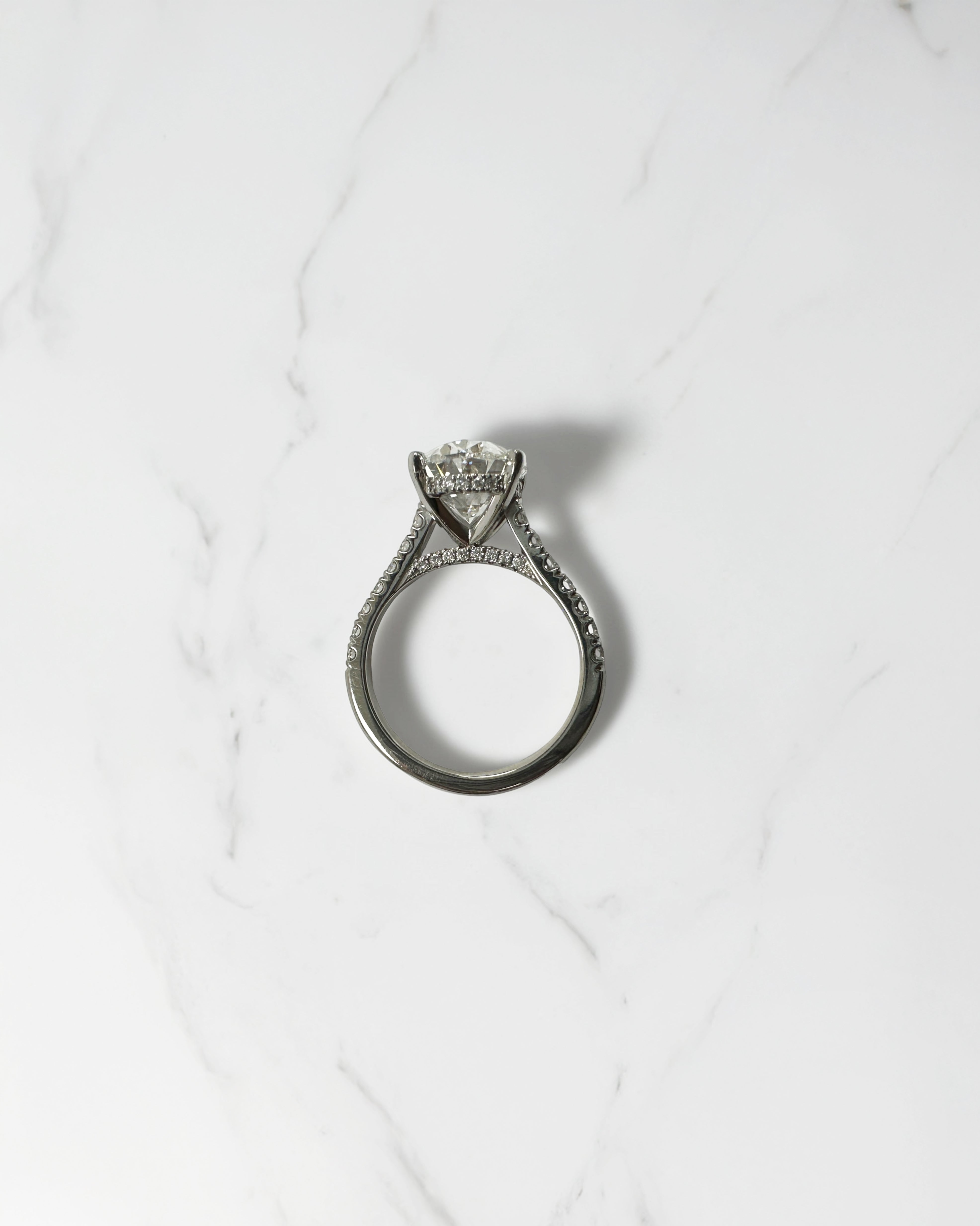 3ct Oval cut Cathedral Setting lab grown diamond engagement ring in platinum on hand