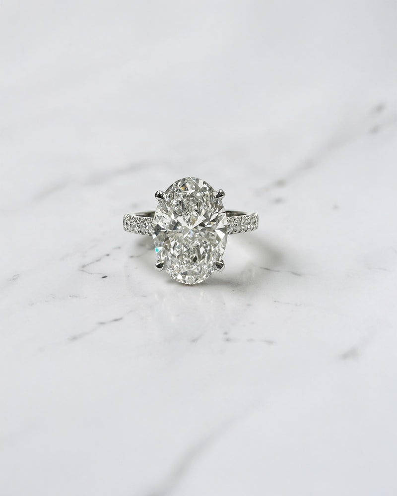 3ct Oval cut Cathedral Setting lab grown diamond engagement ring in platinum on hand
