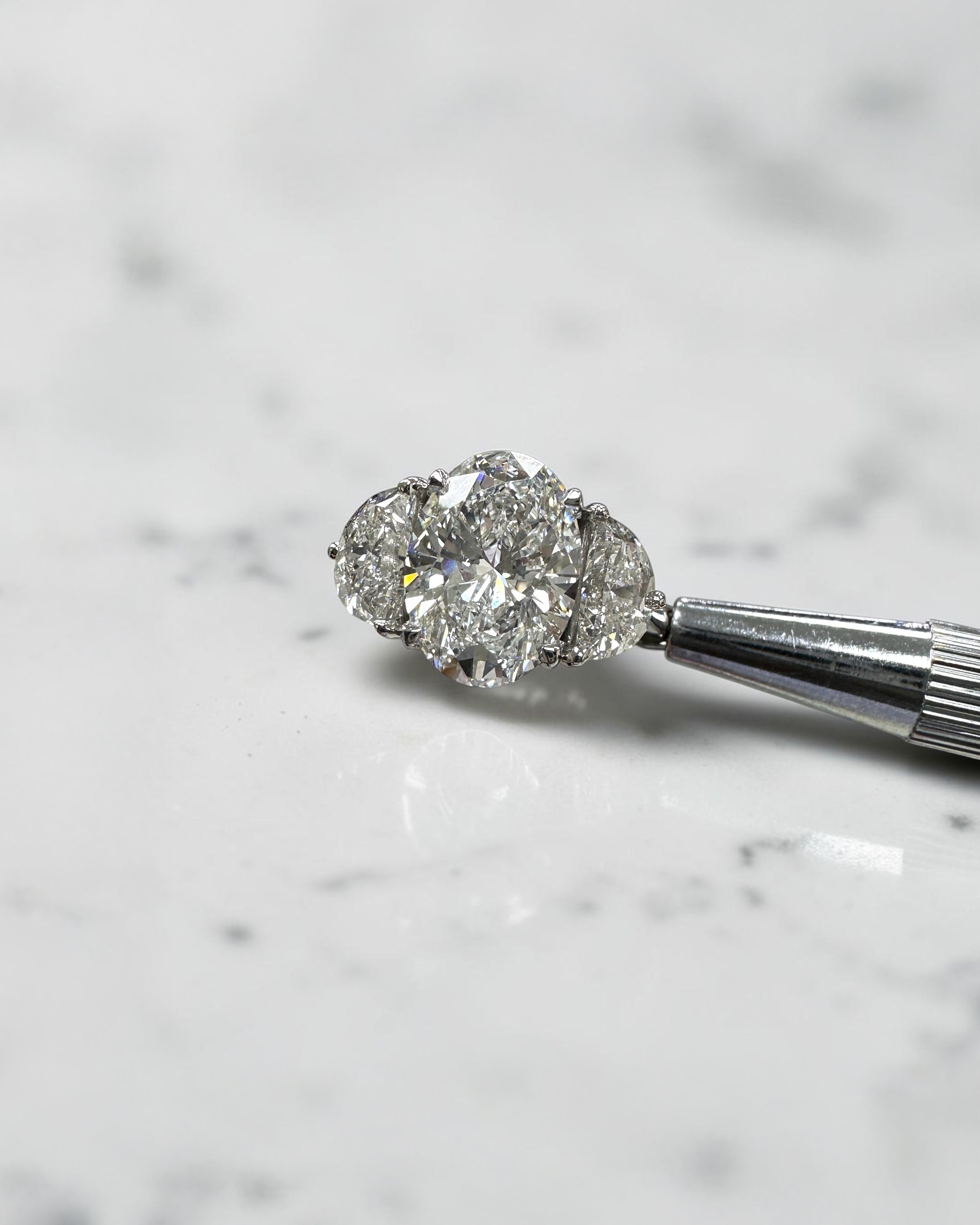 3ct oval cut lab grown diamond engagement ring with half moon side stones and hidden halo, total 4.40ct, polished platinum, handcrafted in London