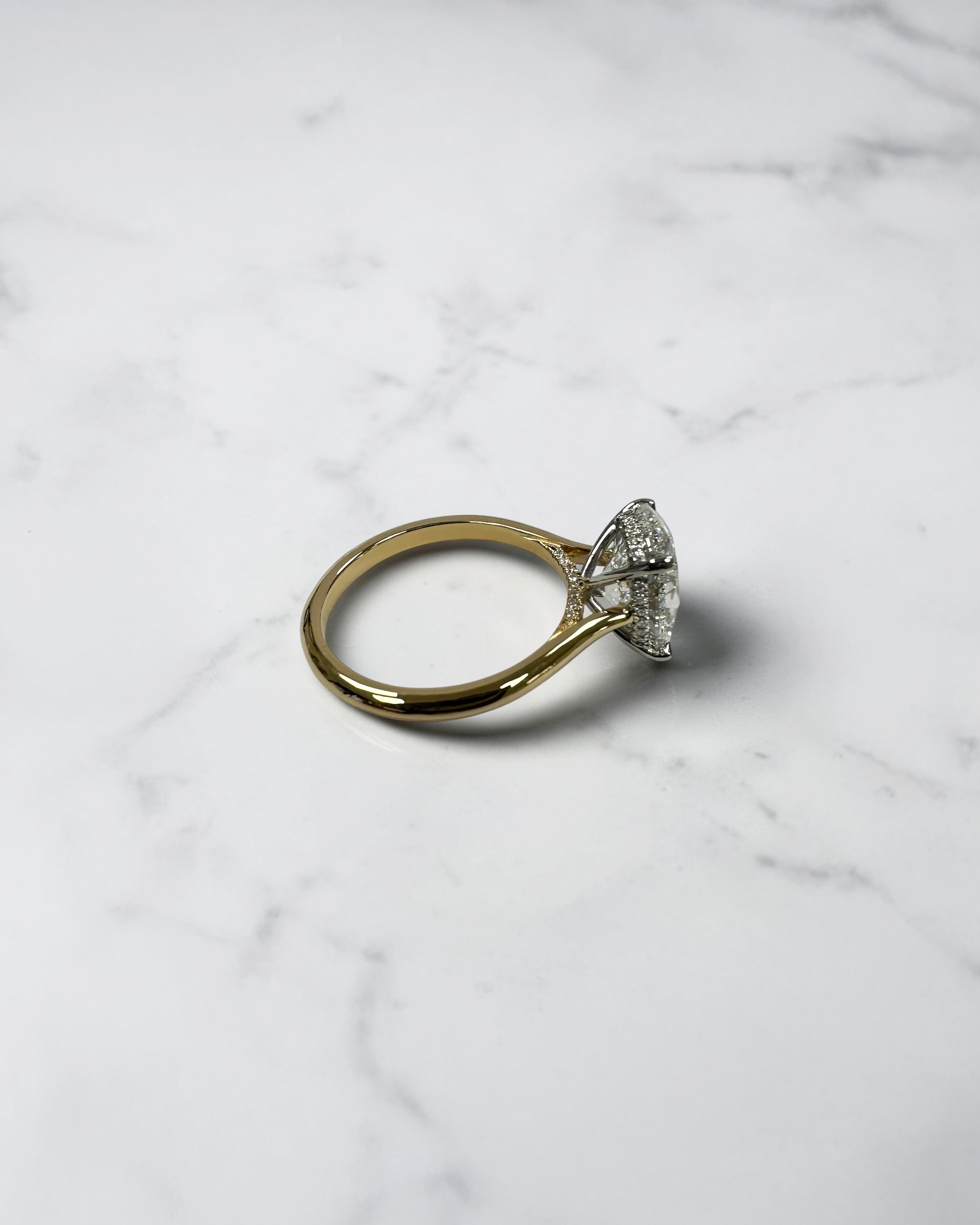 3ct oval cut lab grown diamond engagement ring with hidden halo and cathedral setting in two tone yellow gold plain band with platinum head solitaire, handcrafted in London
