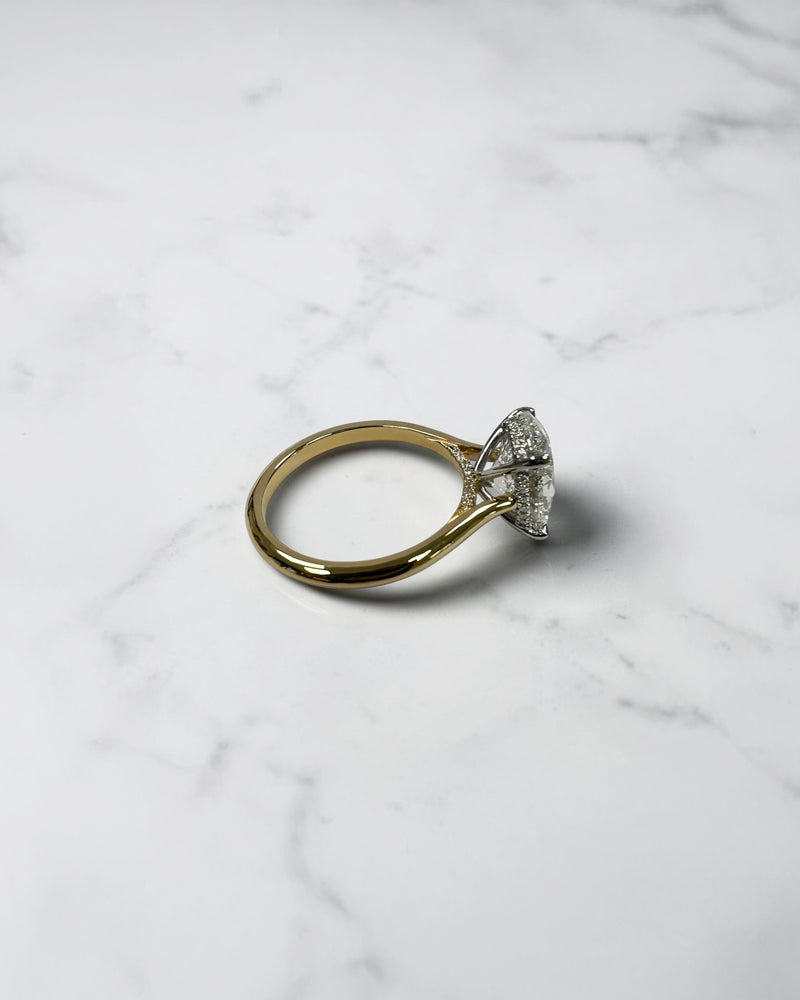 3ct oval cut lab grown diamond engagement ring with hidden halo and cathedral setting in two tone yellow gold plain band with platinum head solitaire, handcrafted in London