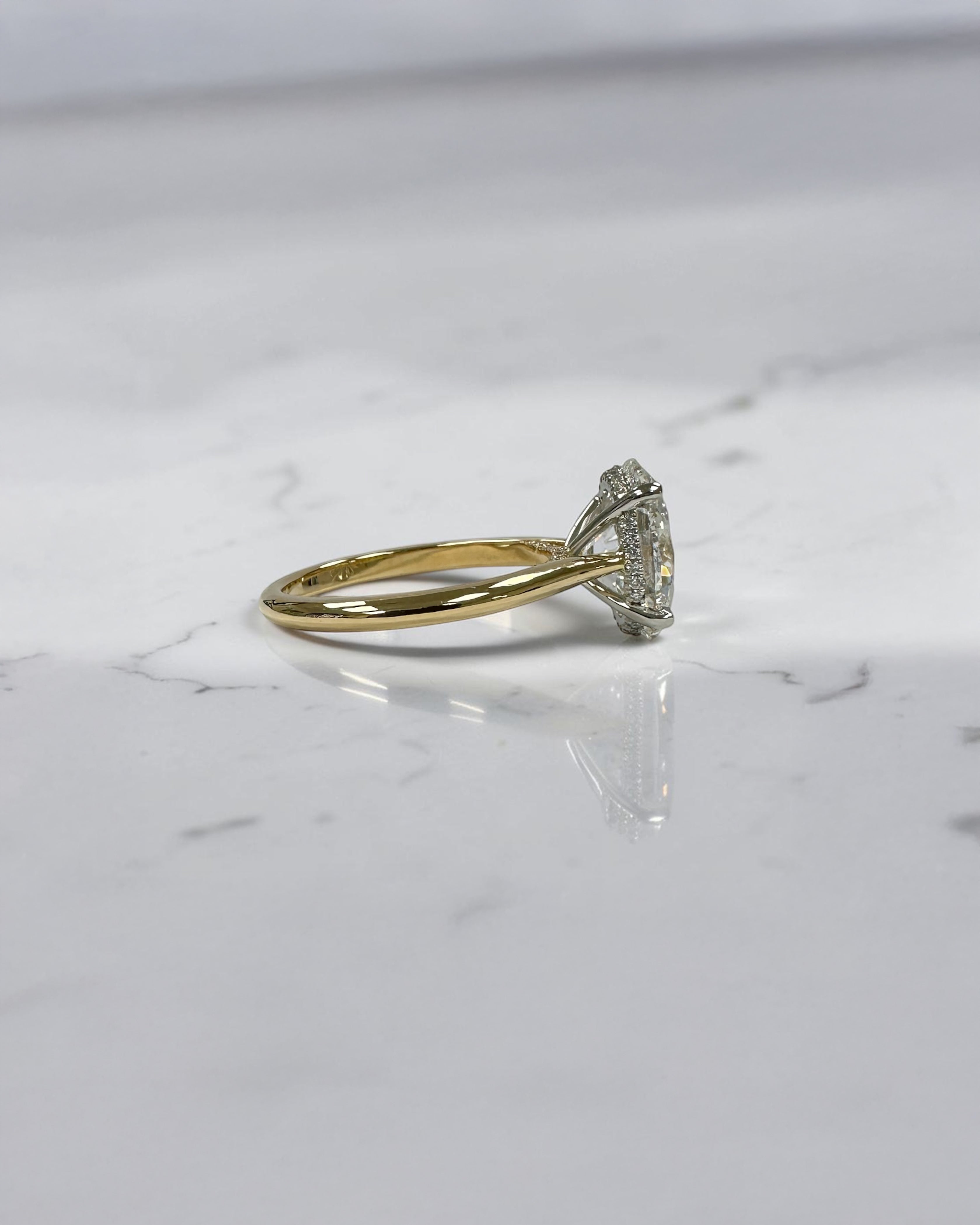 3ct oval cut lab grown diamond engagement ring with hidden halo and cathedral setting in two tone yellow gold plain band with platinum head solitaire, handcrafted in London