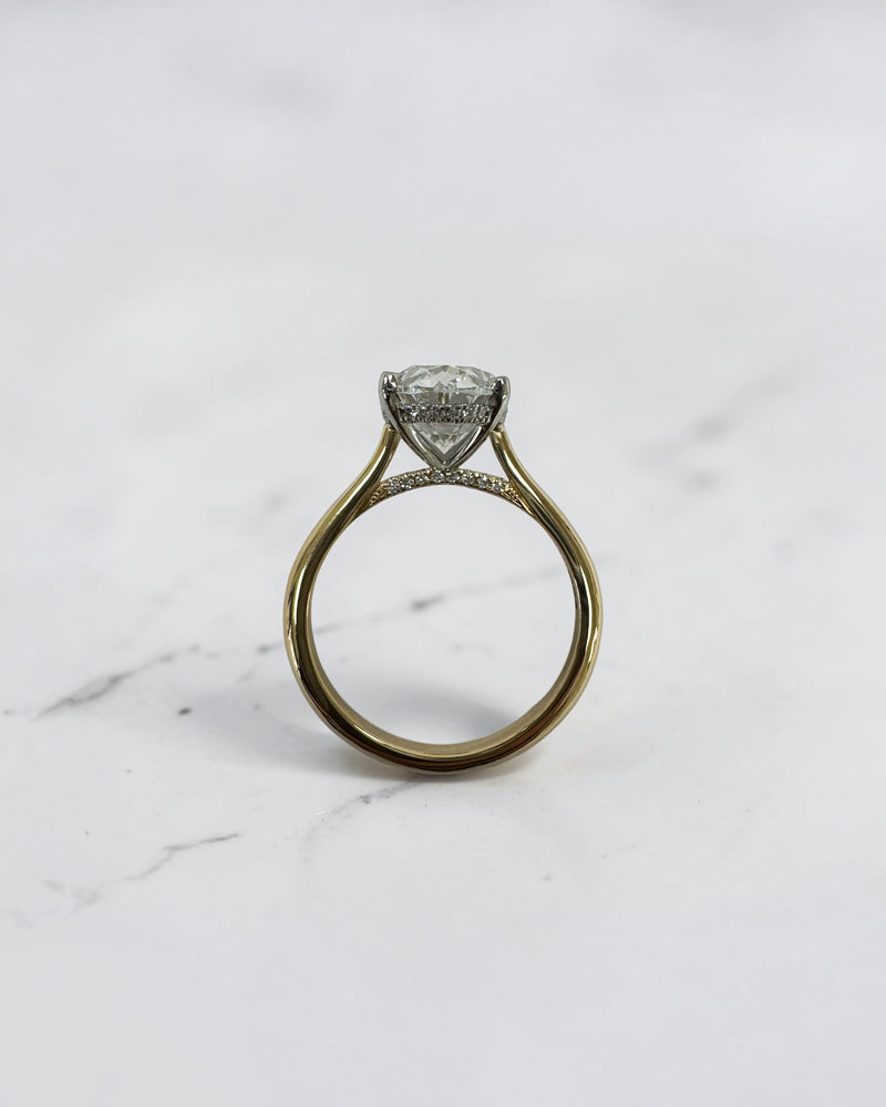 3ct oval cut lab grown diamond engagement ring with hidden halo and cathedral setting in two tone yellow gold plain band with platinum head solitaire, handcrafted in London