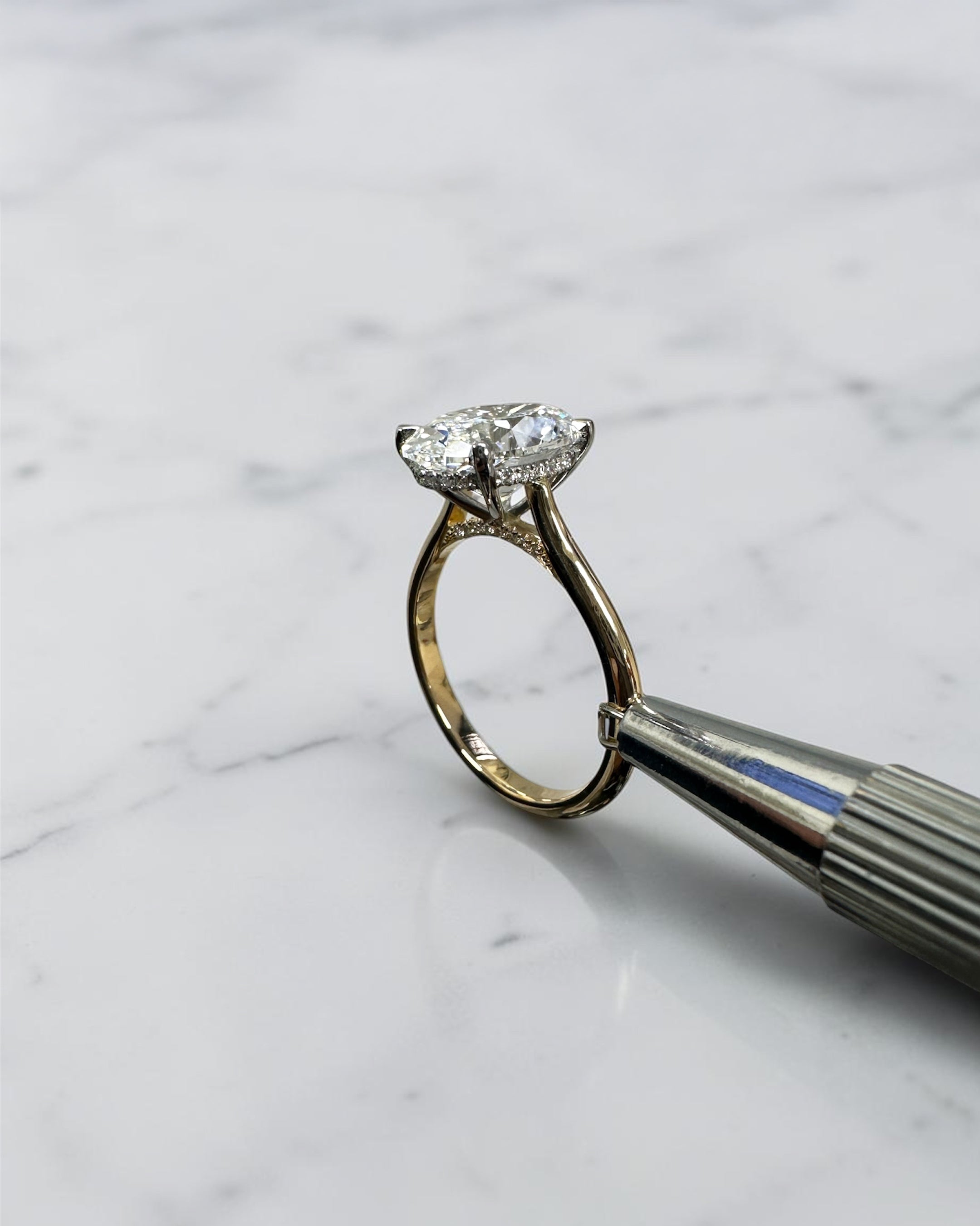 3ct oval cut lab grown diamond engagement ring with hidden halo and cathedral setting in two tone yellow gold plain band with platinum head solitaire, handcrafted in London