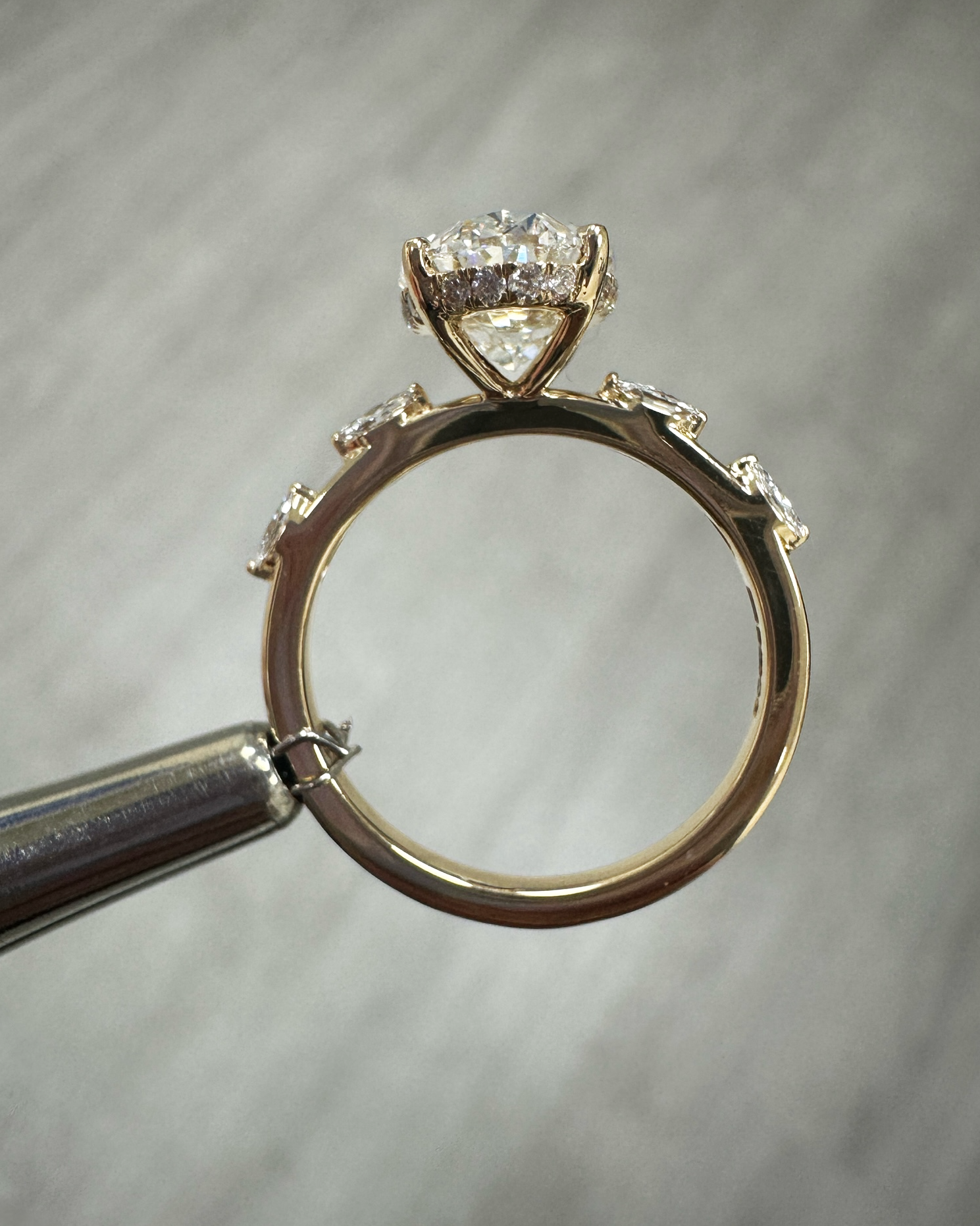 3ct oval cut lab grown diamond marquise spaced band engagement ring, hidden halo 18kt yellow gold made in London by Layla Diamonds