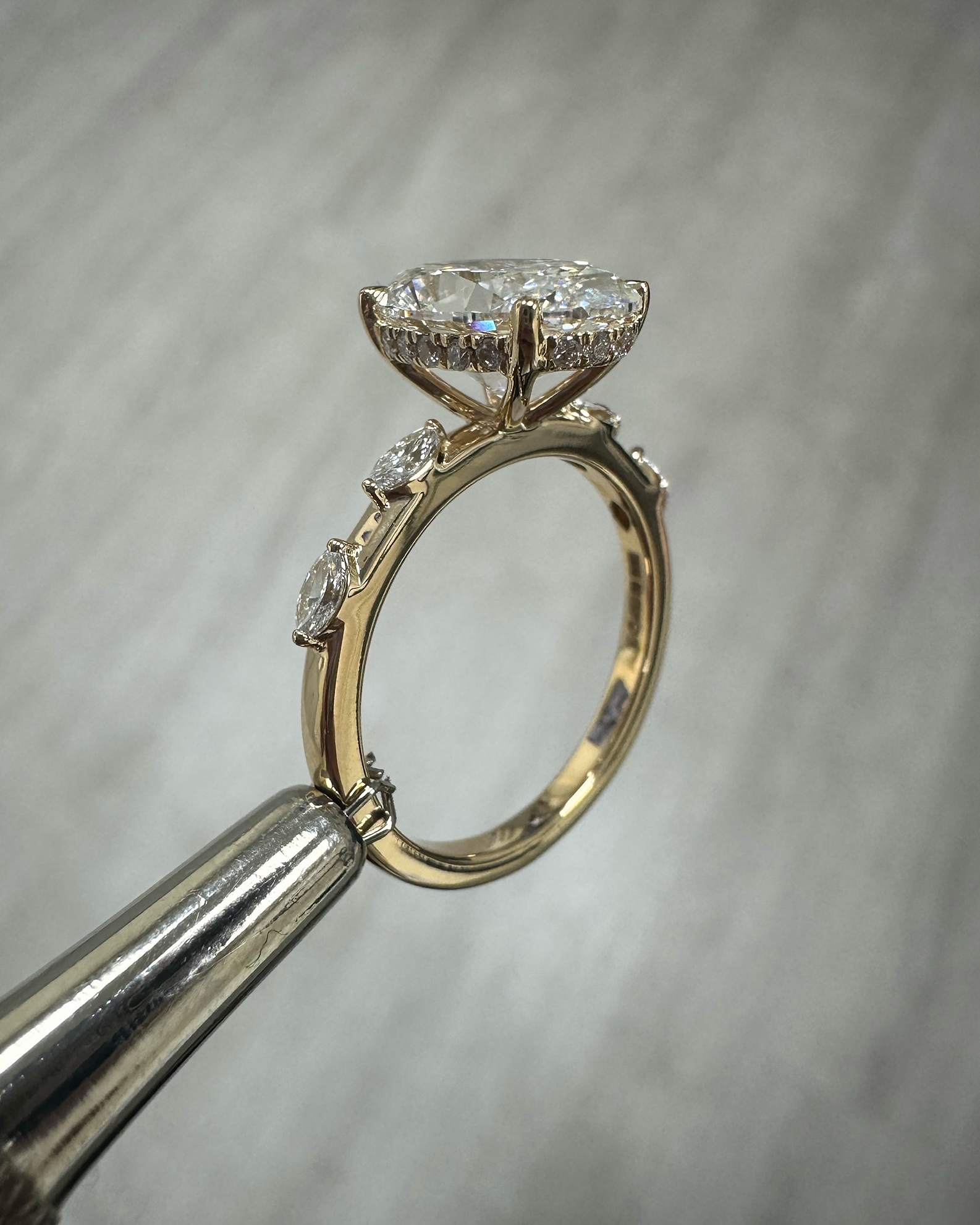 3ct oval cut lab grown diamond marquise spaced band engagement ring, hidden halo 18kt yellow gold made in London by Layla Diamonds