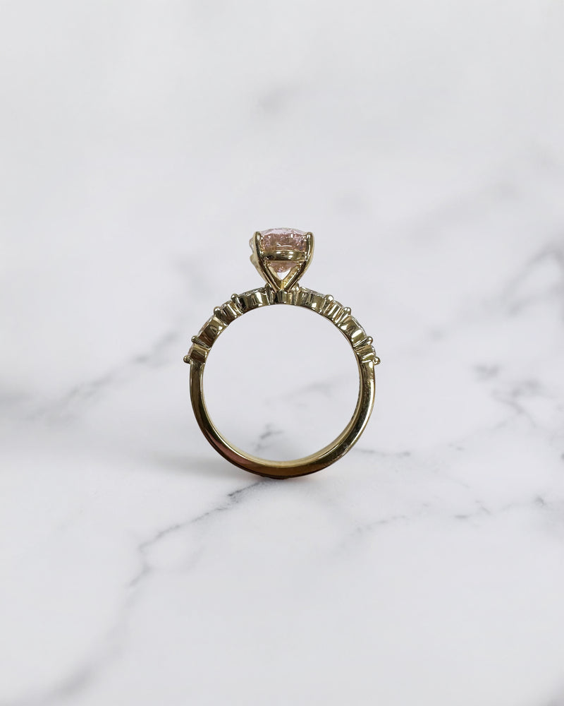 3ct pink oval cut lab grown diamond engagement ring with a floating setting, marquise and round diamond band in 18ct yellow gold, handcrafted in London by Layla Diamonds.