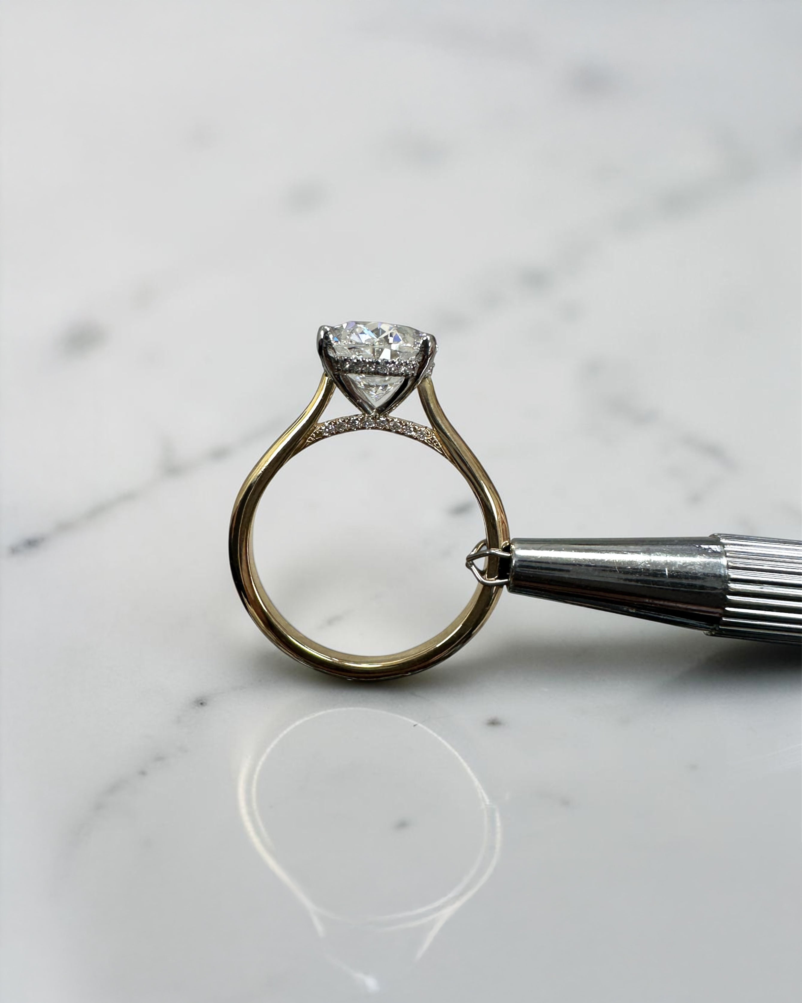 3ct oval cut lab grown diamond engagement ring with hidden halo and cathedral setting in two tone yellow gold plain band with platinum head solitaire, handcrafted in London