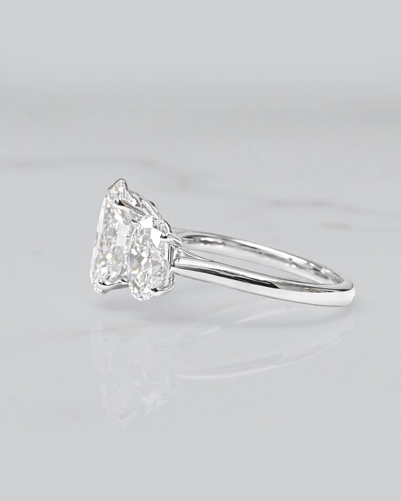 5ct oval cut lab grown diamond trilogy engagement ring with 3ct centre oval and matching oval side stones in polished white gold or platinum setting