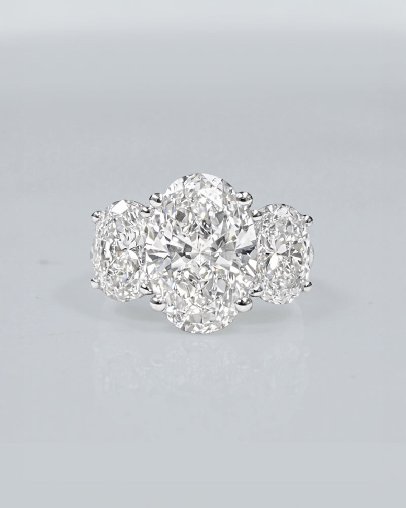 5ct oval cut lab grown diamond trilogy engagement ring with 3ct centre oval and matching oval side stones in polished white gold or platinum setting