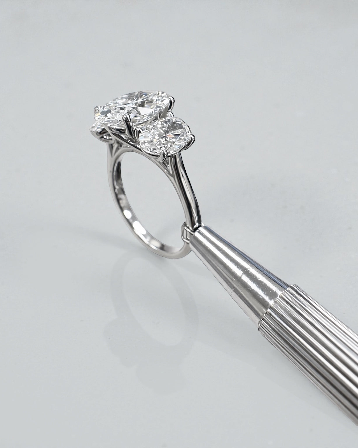5ct oval cut lab grown diamond trilogy engagement ring with 3ct centre oval and matching oval side stones in polished white gold or platinum setting