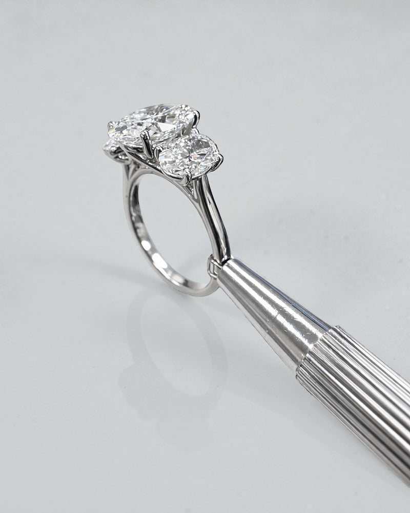 5ct oval cut lab grown diamond trilogy engagement ring with 3ct centre oval and matching oval side stones in polished white gold or platinum setting