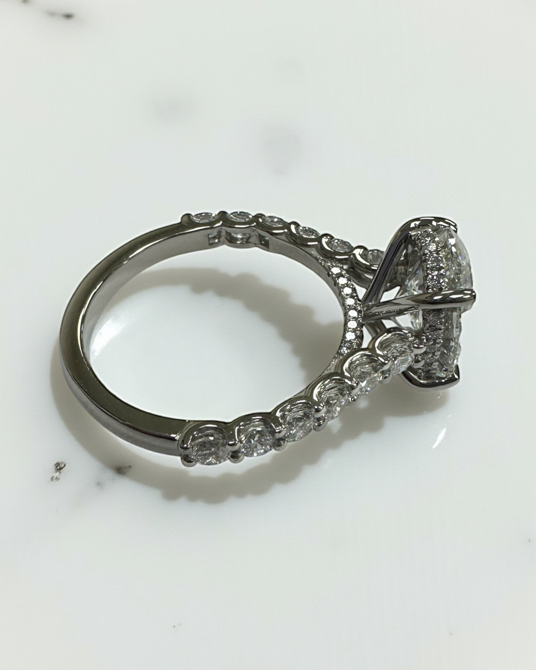 3ct oval cut lab grown diamond u prong setting, cathedral engagement ring in platinum on hand