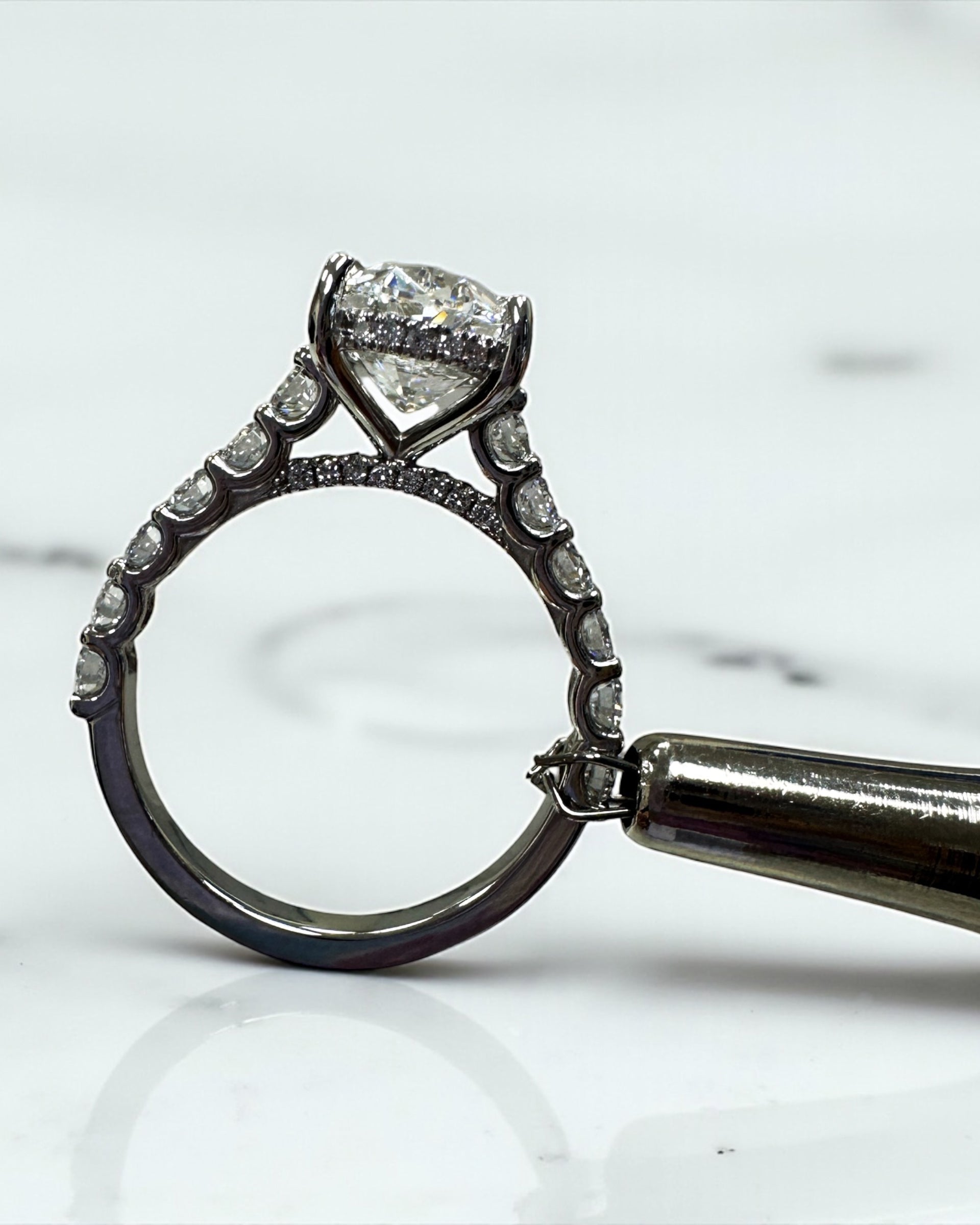 3ct oval cut lab grown diamond u prong setting, cathedral engagement ring in platinum on hand