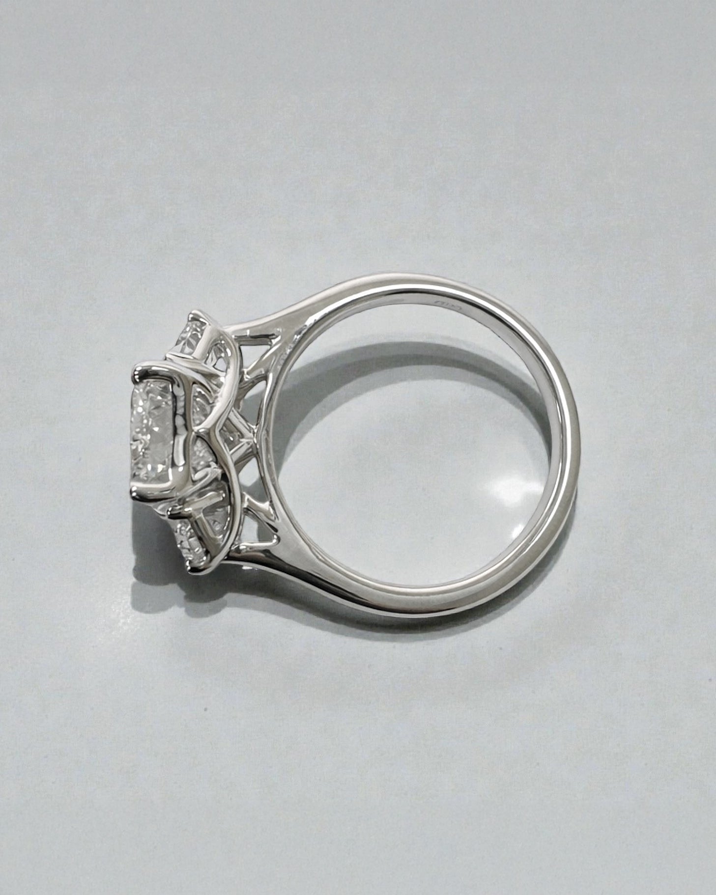 3ct radiant cut lab grown diamond trilogy engagement ring with half moon side stones in polished platinum