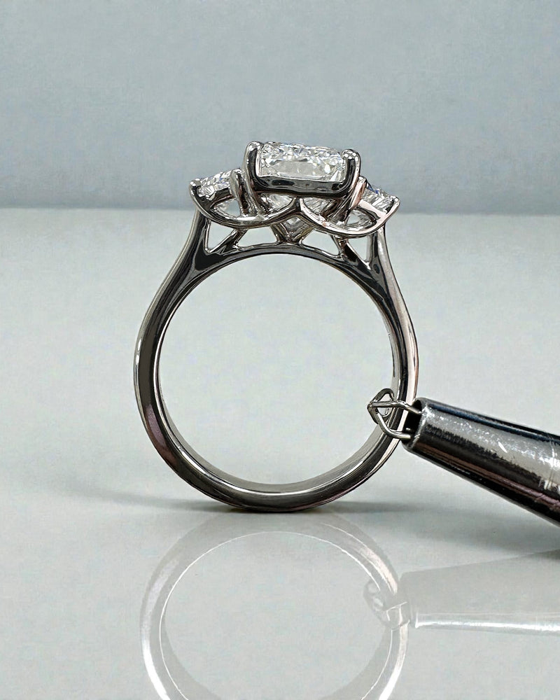 3ct radiant cut lab grown diamond trilogy engagement ring with half moon side stones in polished platinum