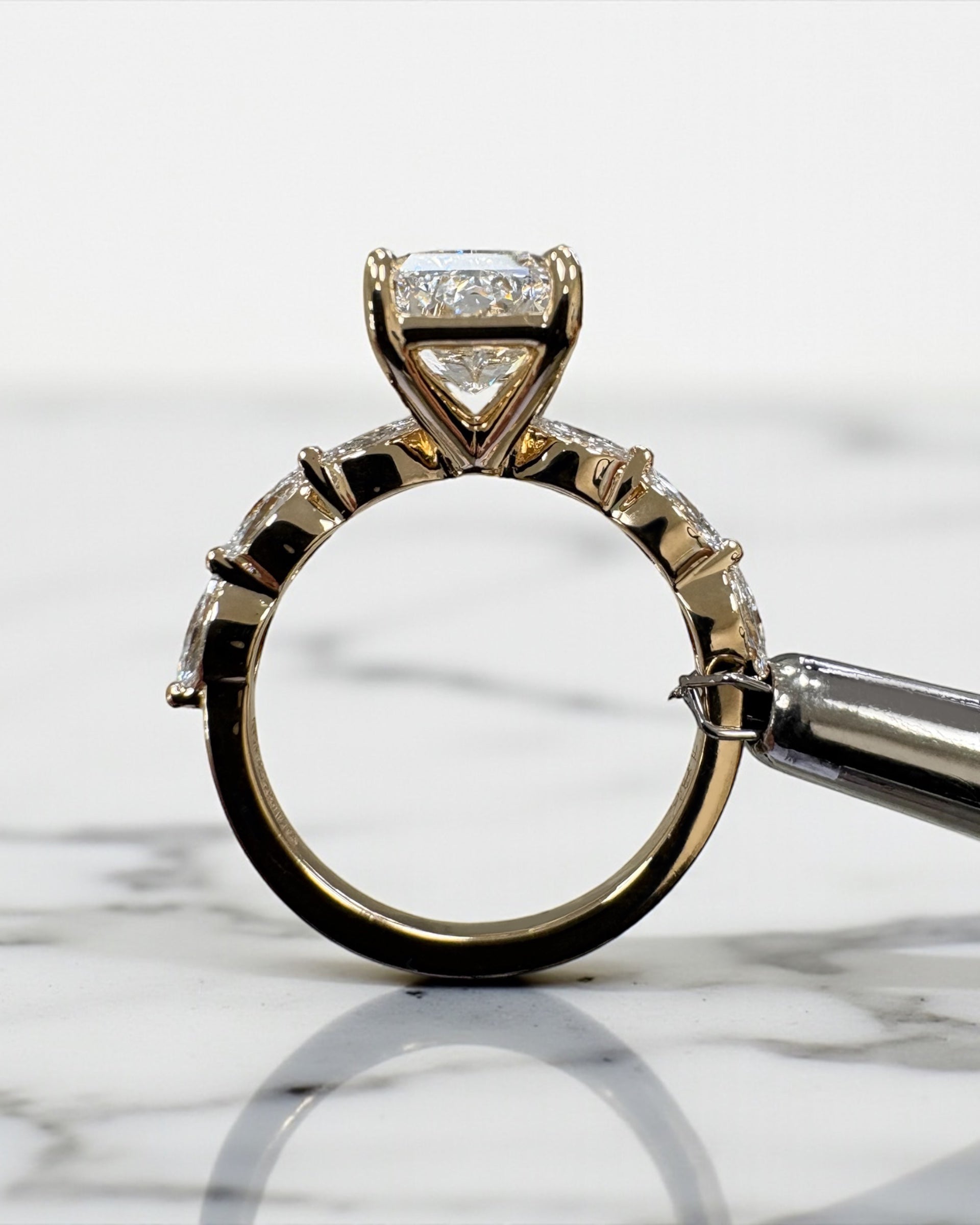 3ct Radiant cut lab grown diamond set with marquise side diamonds on the band, engagement ring, 18kt yellow gold 