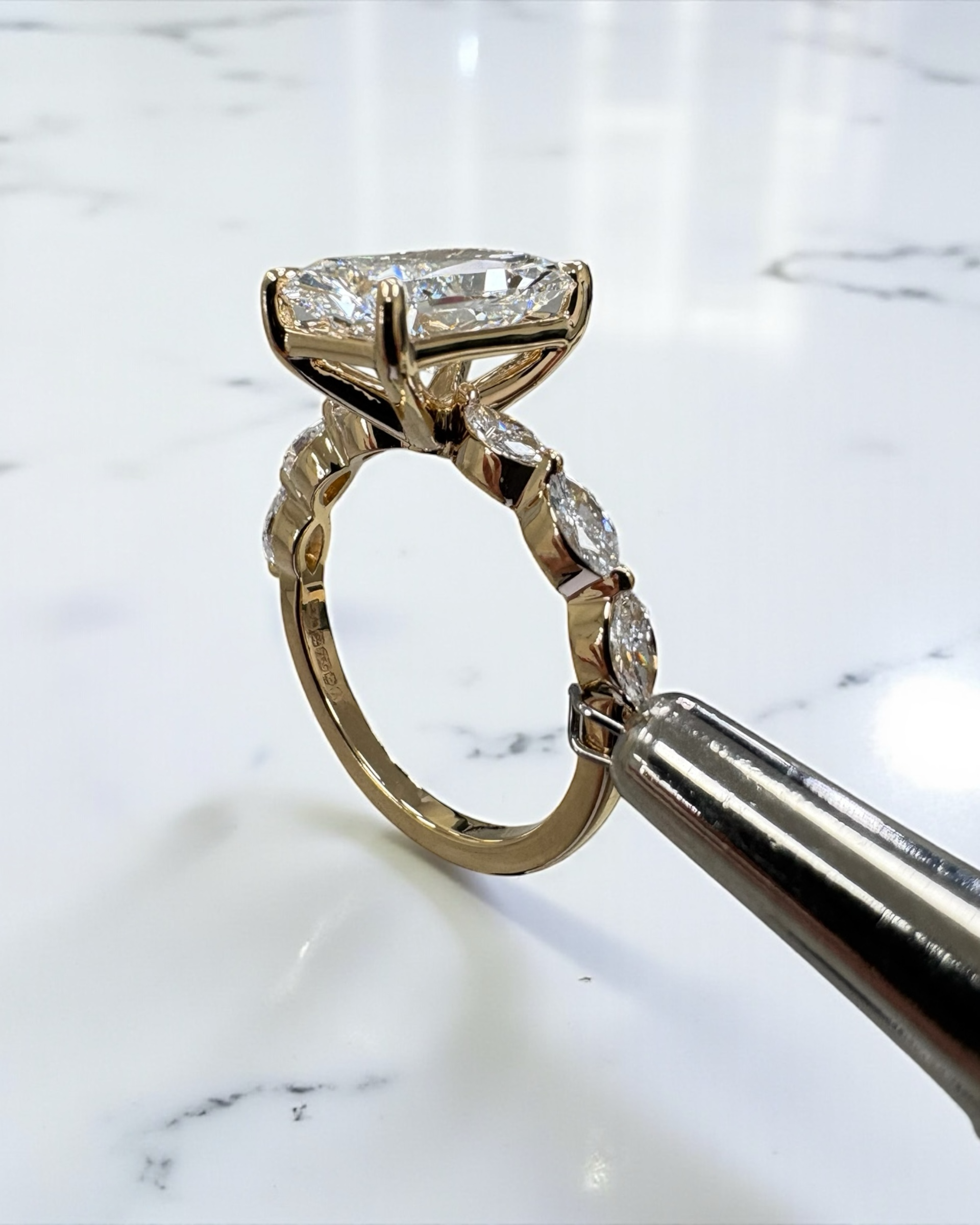 3ct Radiant cut lab grown diamond set with marquise side diamonds on the band, engagement ring, 18kt yellow gold 