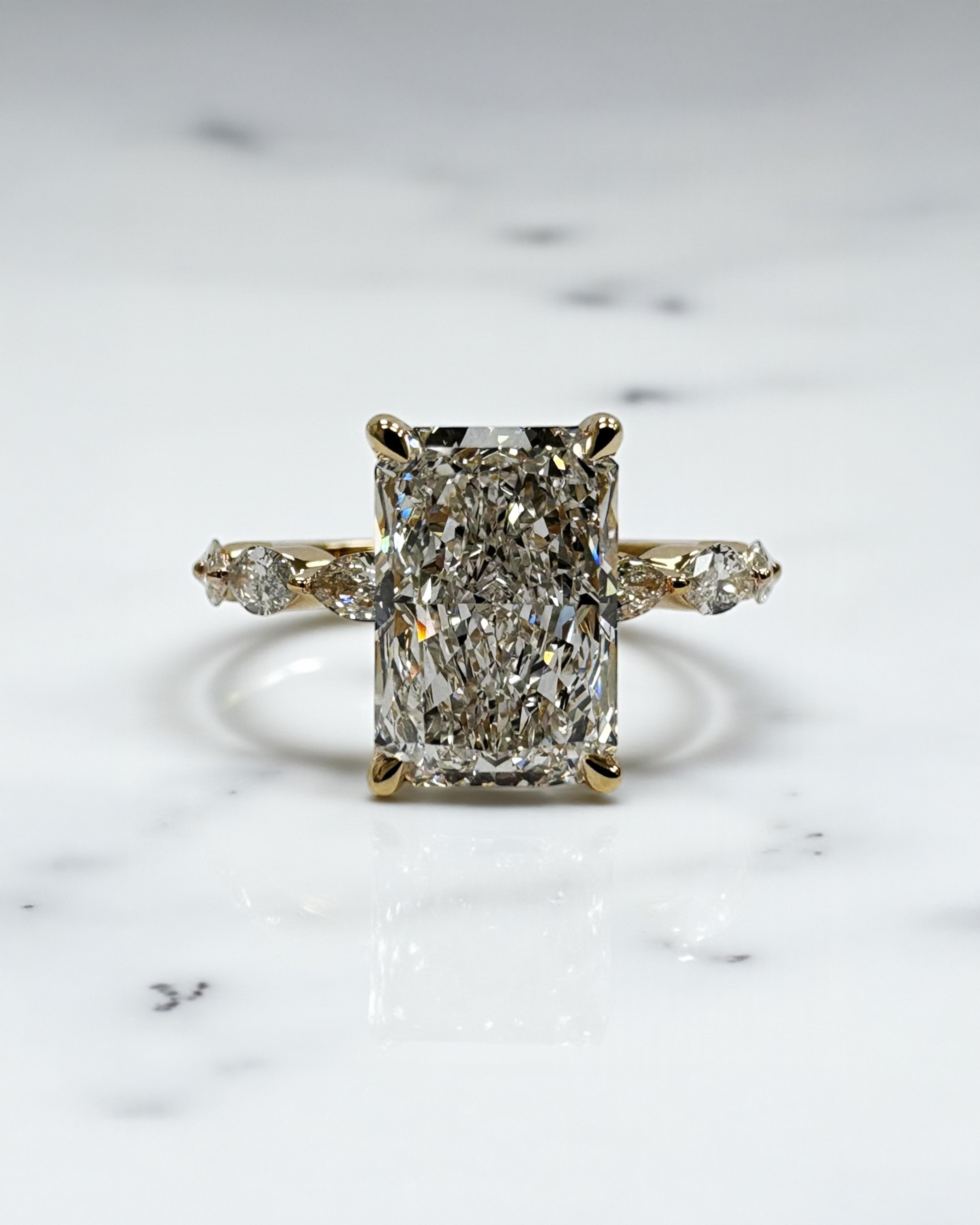 3ct Radiant cut lab grown diamond set with marquise side diamonds on the band, engagement ring, 18kt yellow gold 