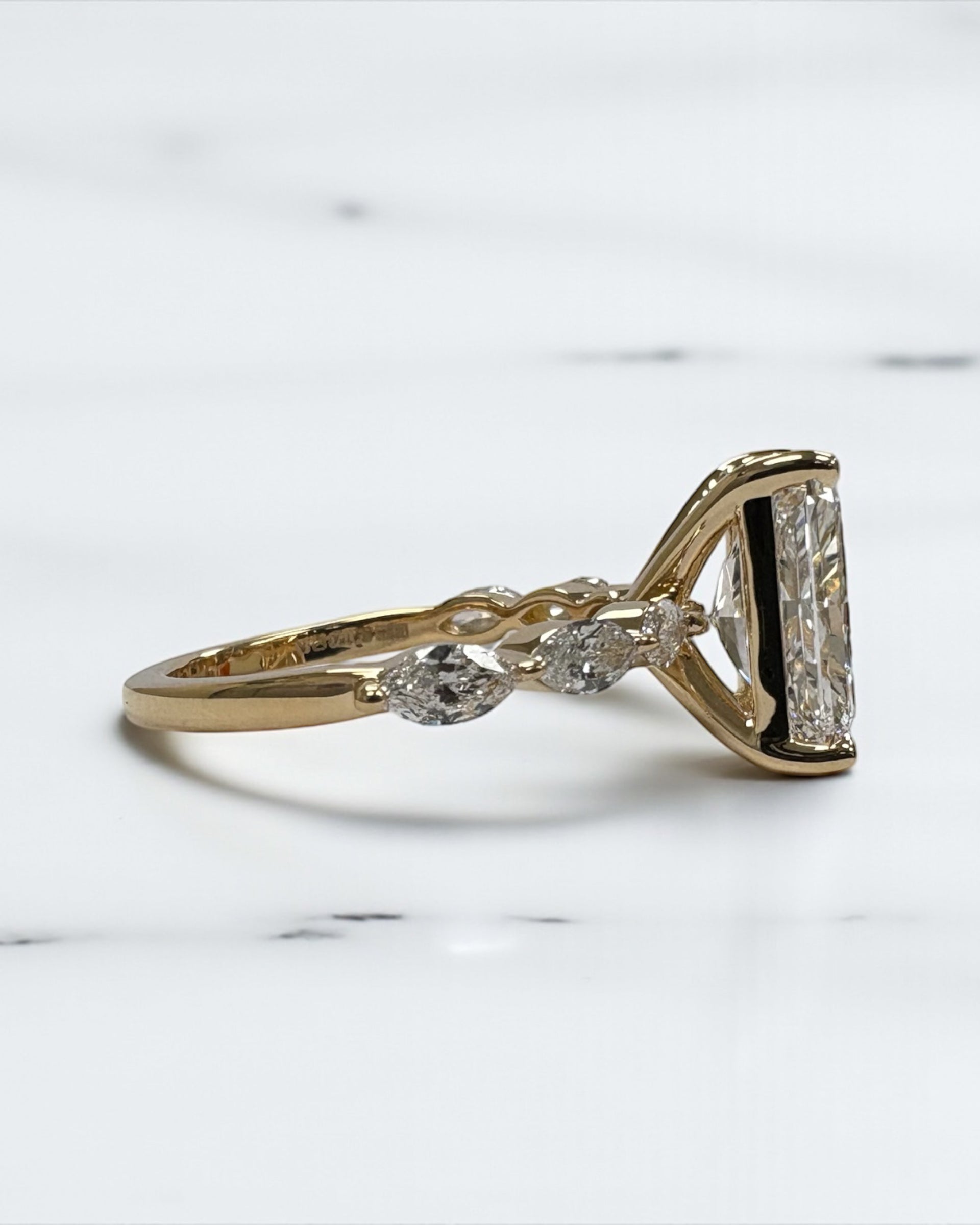 3ct Radiant cut lab grown diamond set with marquise side diamonds on the band, engagement ring, 18kt yellow gold 