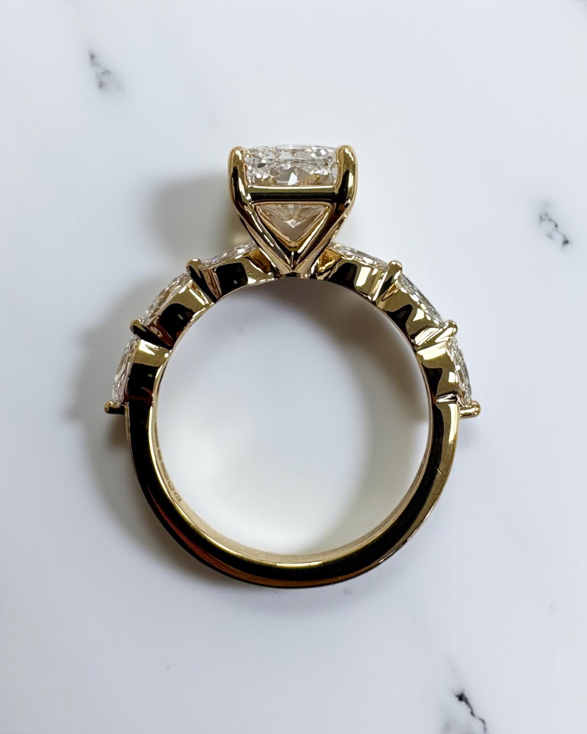 3ct Radiant cut lab grown diamond set with marquise side diamonds on the band, engagement ring, 18kt yellow gold 