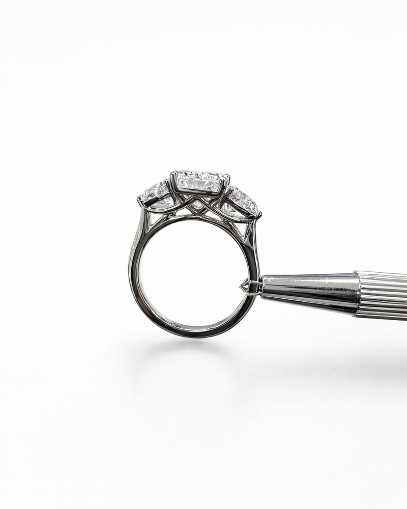 3ct radiant cut lab grown diamond engagement ring UK with trillion side stones, 4.40ct trilogy engagement ring design in polished white gold or platinum handcrafted in London