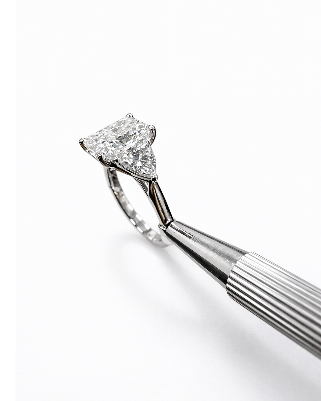 3ct radiant cut lab grown diamond engagement ring UK with trillion side stones, 4.40ct trilogy engagement ring design in polished white gold or platinum handcrafted in London
