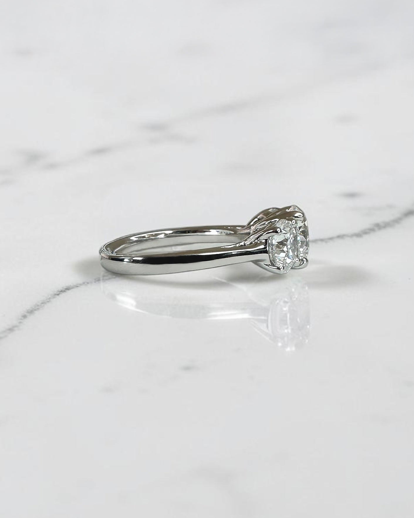 3ct round brilliant cut lab grown diamond trilogy engagement ring with 1.50ct centre diamond and 0.75ct side diamonds in platinum or white gold