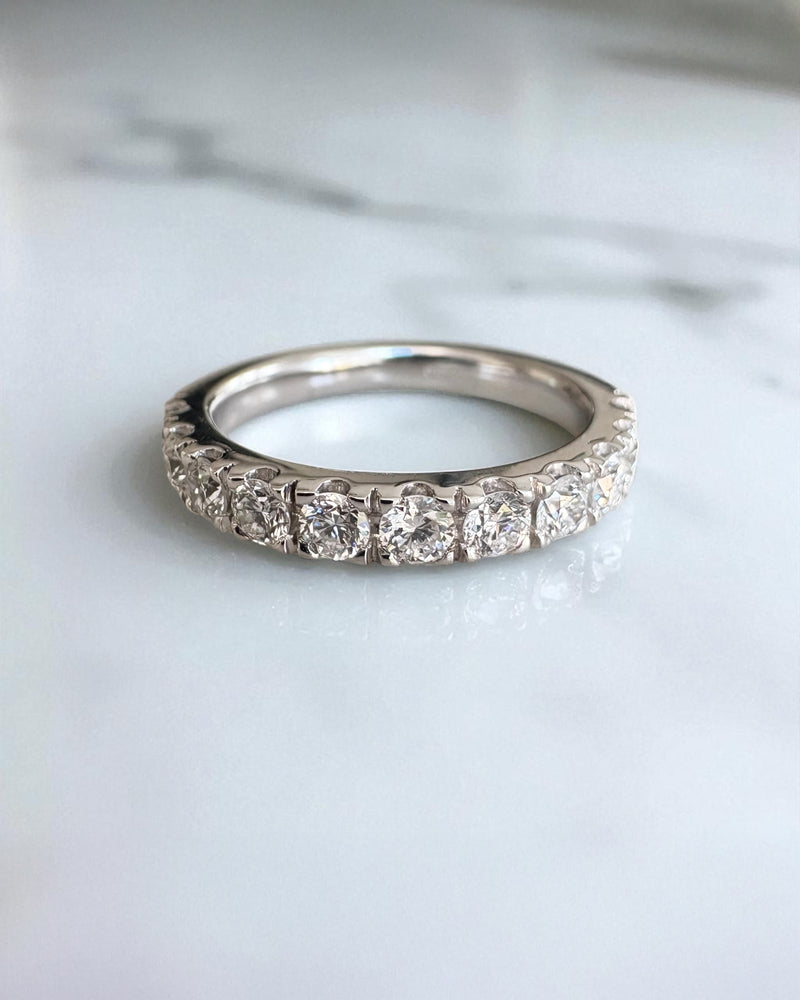 Close-up detail of the round diamonds on this 3mm wide wedding bands for women style.