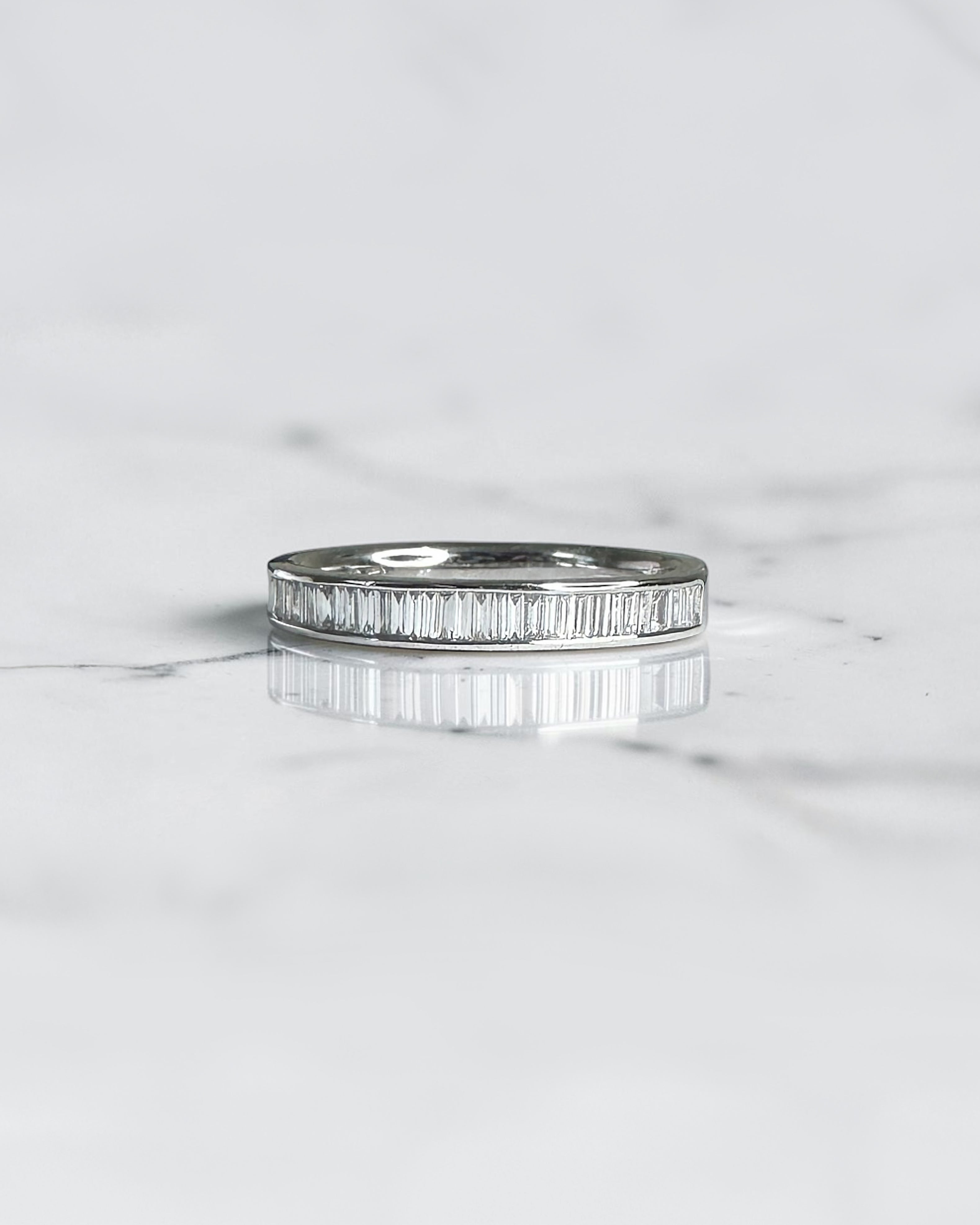 Half set 3mm channel set baguette diamond wedding band in 18ct yellow gold, white gold or platinum, available with lab grown or natural diamonds.