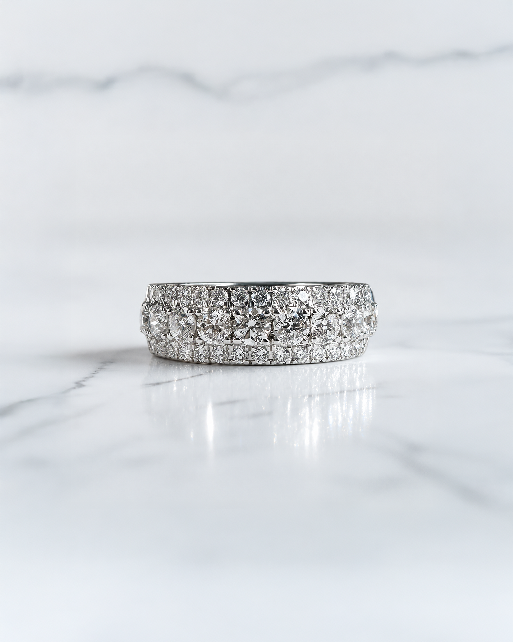 2.70ct three row round brilliant diamond band ring with graduated centre diamonds and 7.7mm wide band
Platinum or 18kt white gold