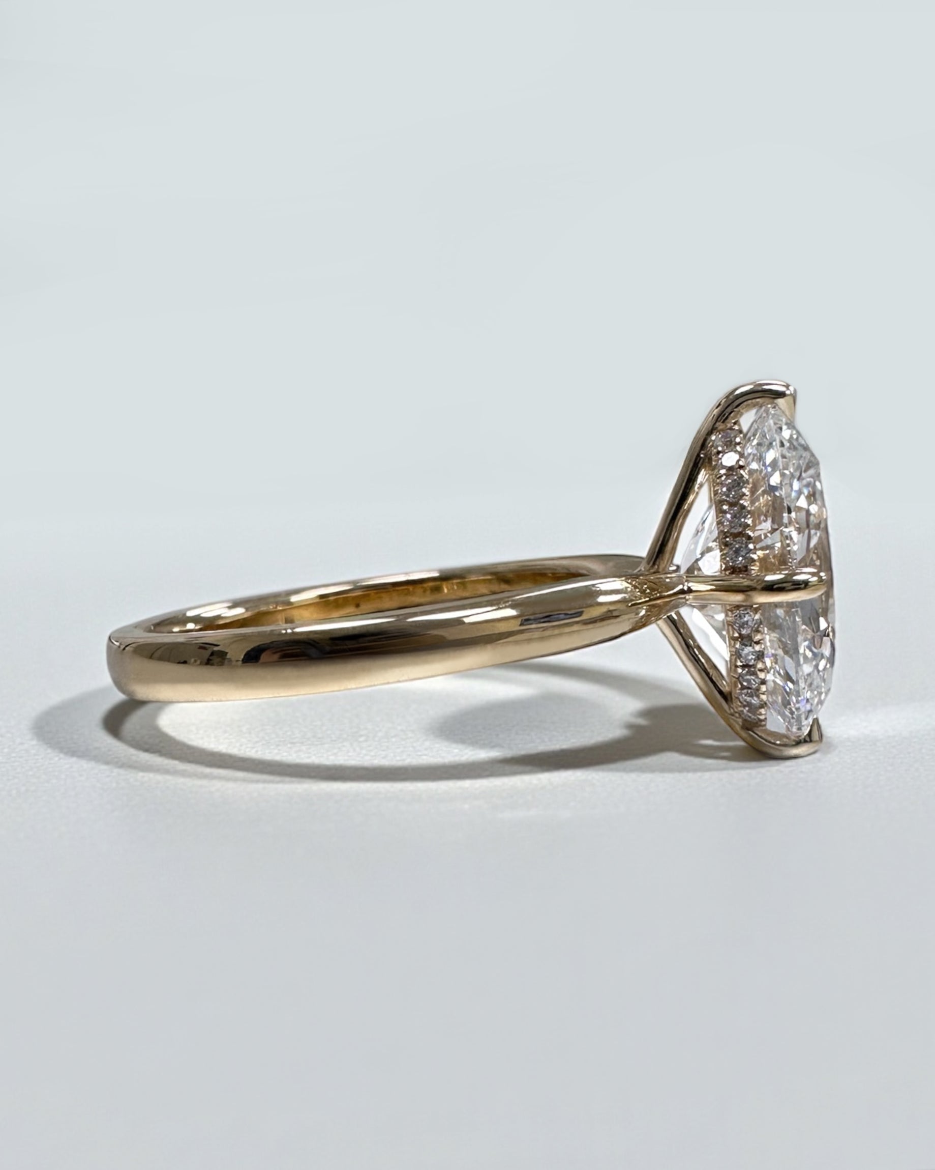 Oval 4ct lab grown diamond solitaire in compass prong setting engagement ring by Layla Diamonds London, 18kt Yellow Gold