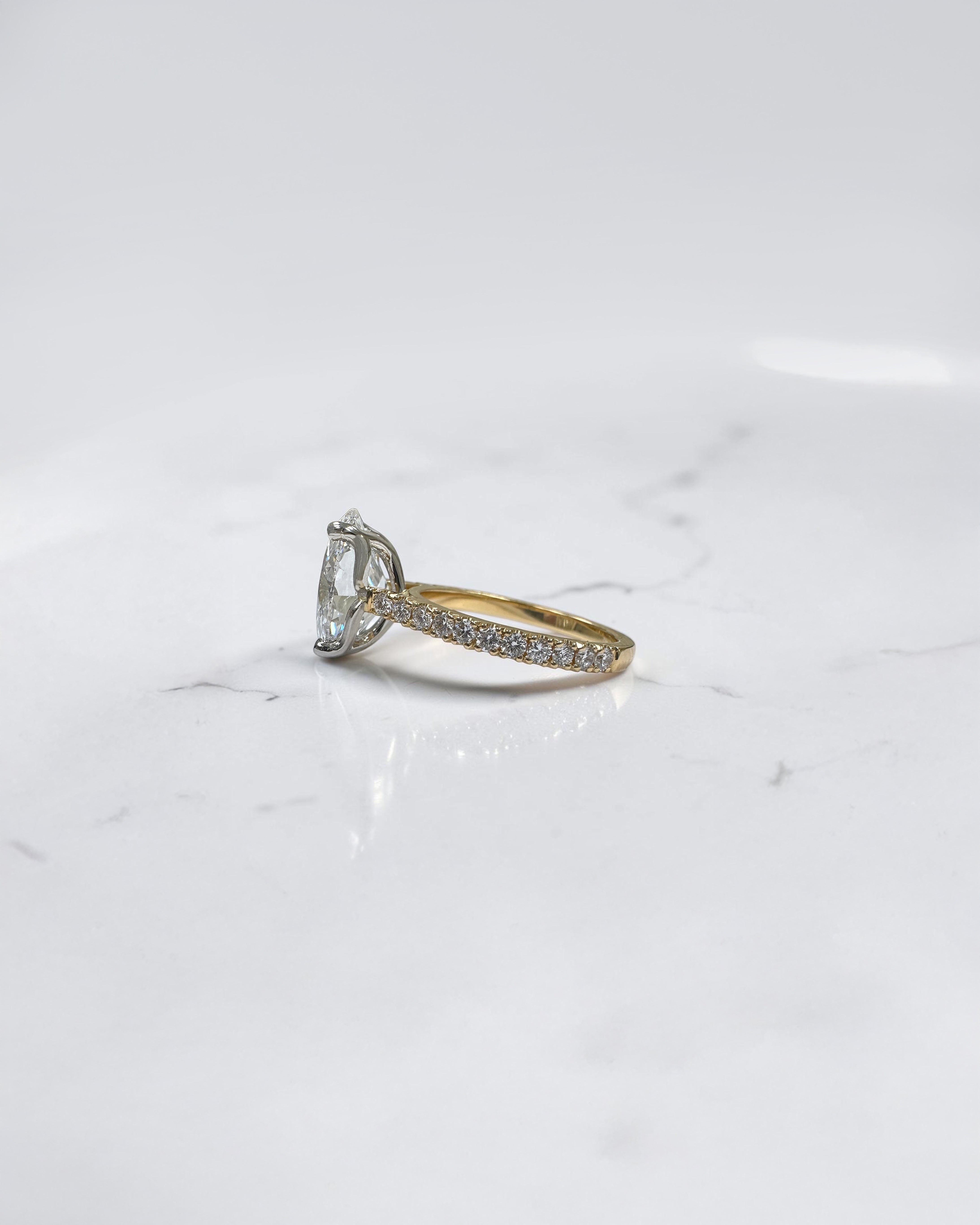 4ct oval cut lab grown diamond engagement ring with lotus head setting and diamond shoulders in yellow gold with platinum head made in London, Layla Diamonds