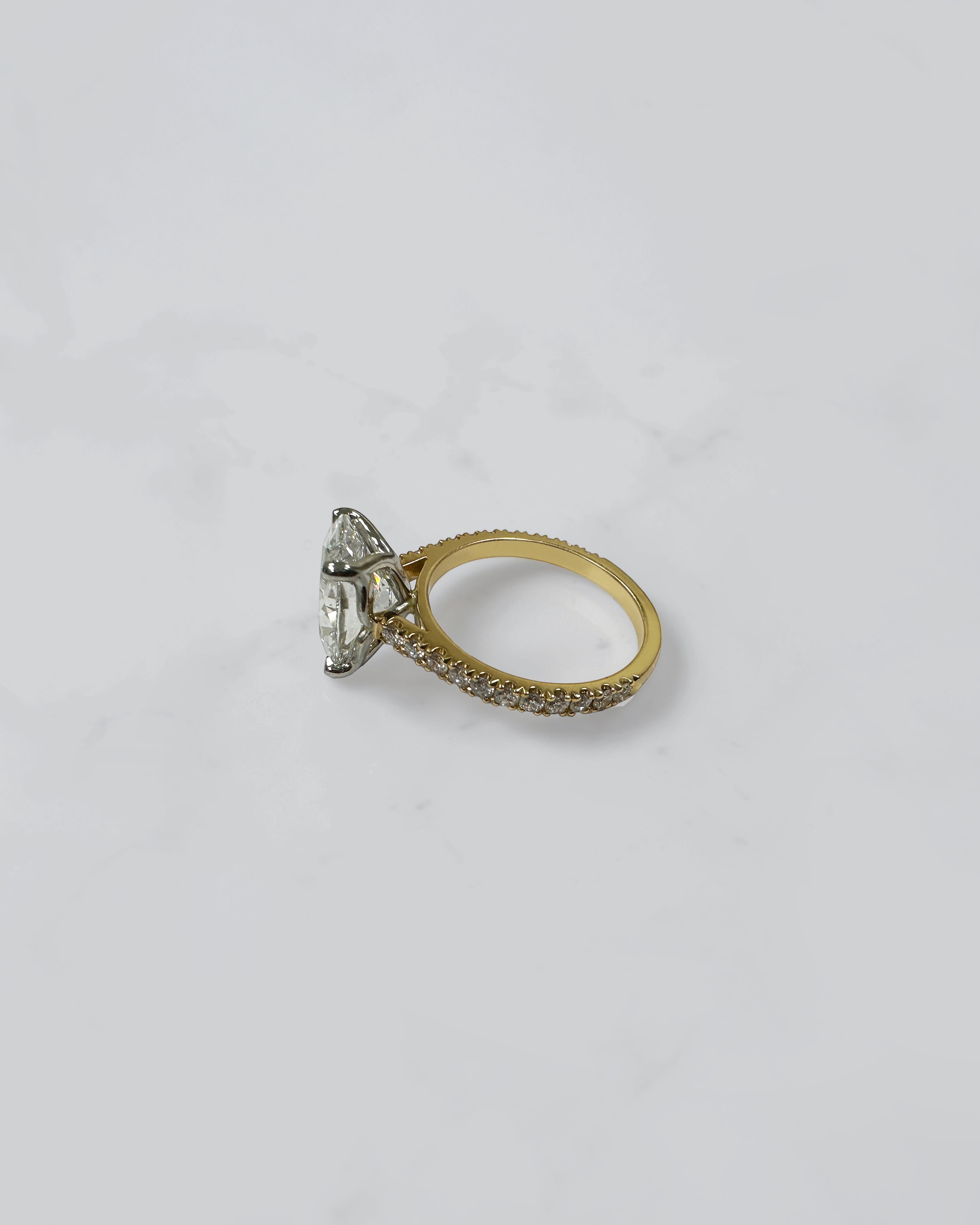 4ct oval cut lab grown diamond engagement ring with lotus head setting and diamond shoulders in yellow gold with platinum head made in London, Layla Diamonds