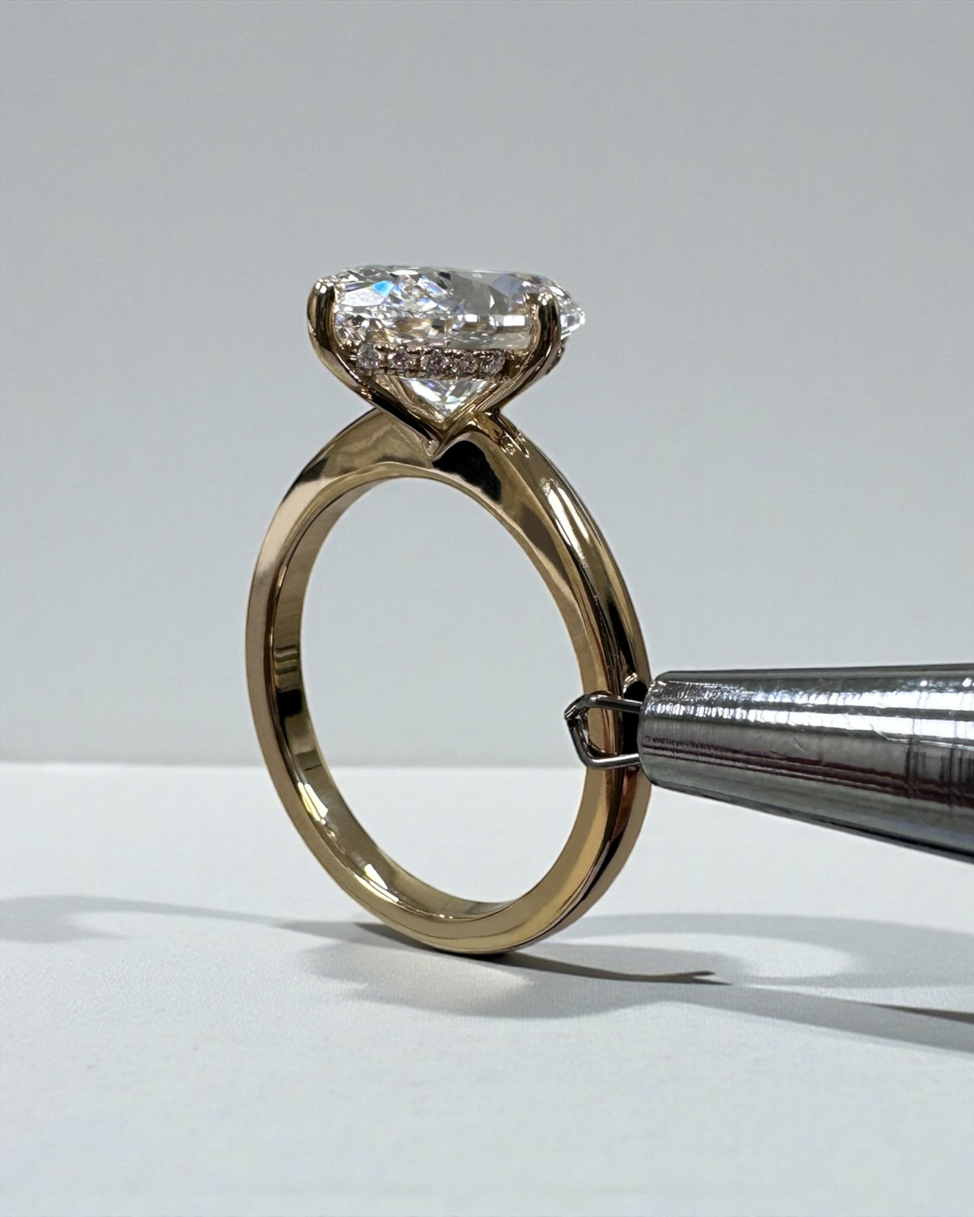 Oval 4ct lab grown diamond solitaire in compass prong setting engagement ring by Layla Diamonds London, 18kt Yellow Gold