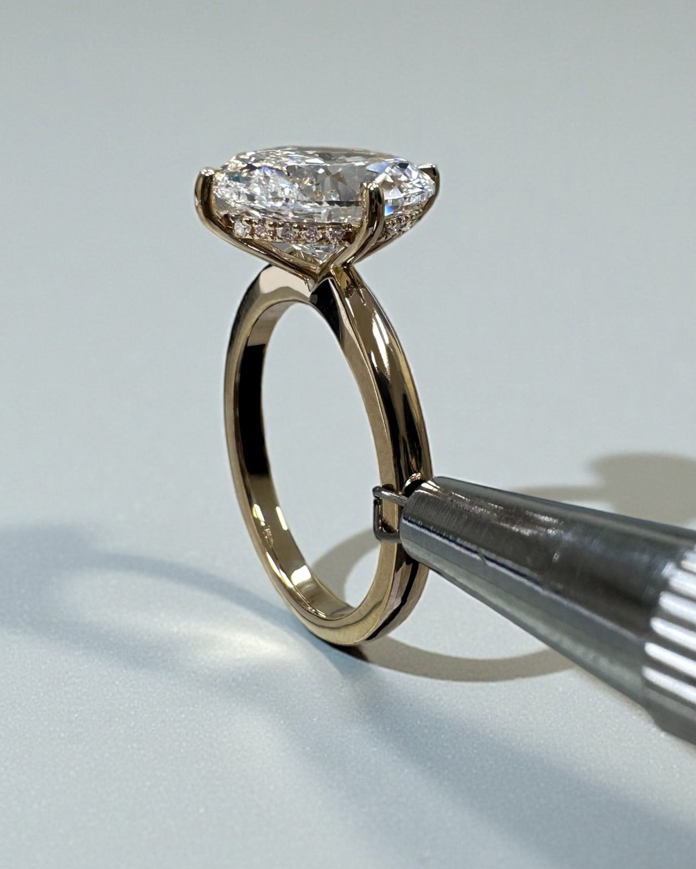 Oval 4ct lab grown diamond solitaire in compass prong setting engagement ring by Layla Diamonds London, 18kt Yellow Gold