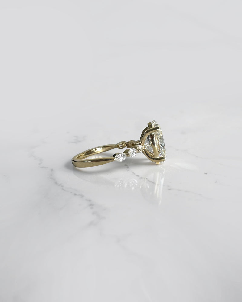 4ct oval cut lab grown diamond engagement ring with marquise cut diamond band in yellow gold, four claw setting, 4.40ct total diamond weight, handcrafted in London