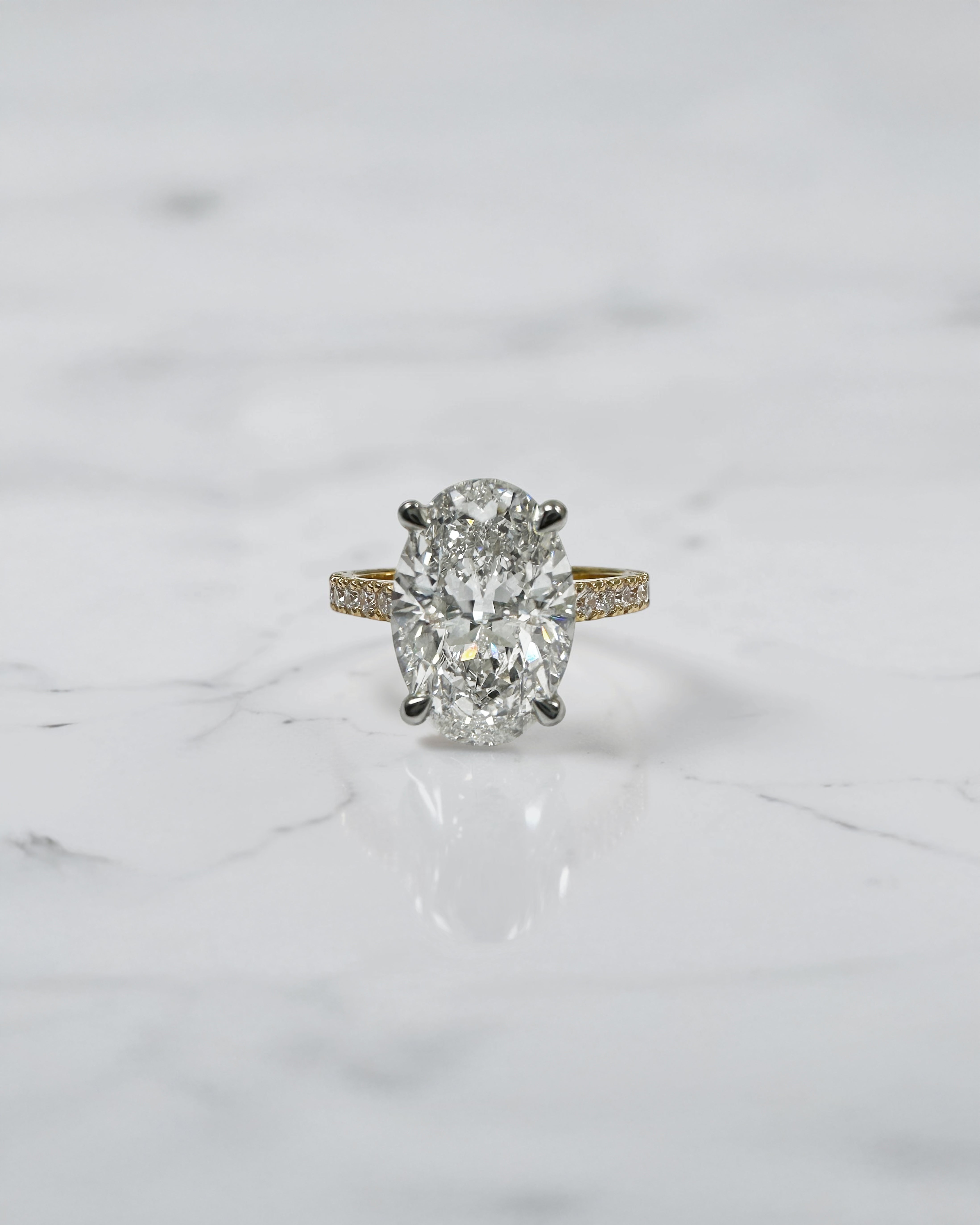 4ct oval cut lab grown diamond engagement ring with lotus head setting and diamond shoulders in yellow gold with platinum head made in London, Layla Diamonds