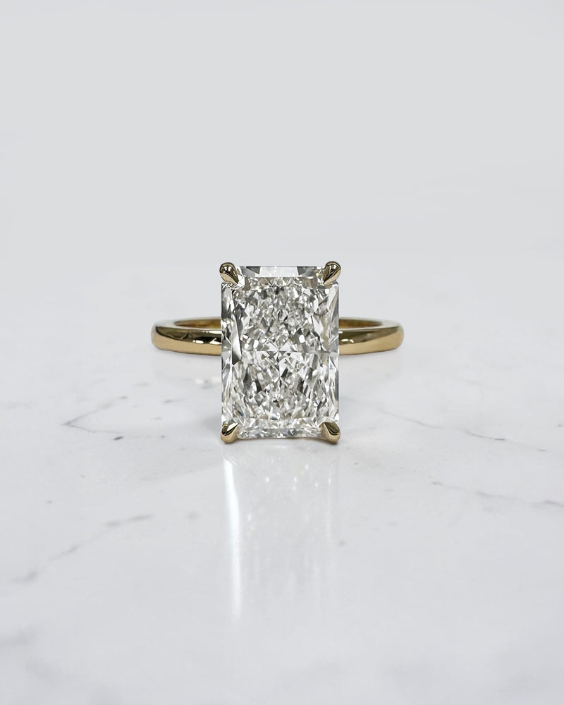 4ct radiant cut lab grown diamond engagement ring with floating setting and wrap around hidden halo 18kt yellow gold