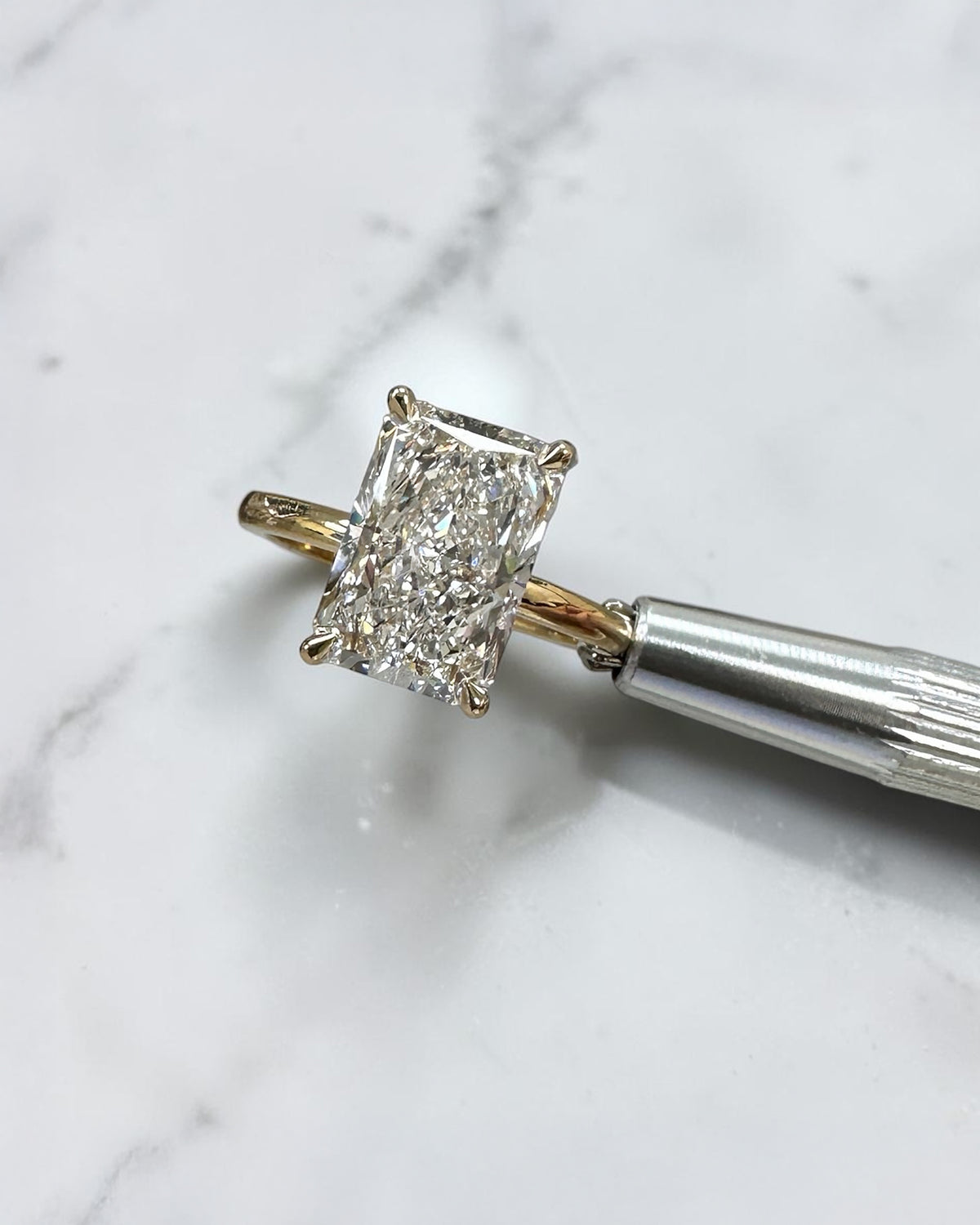 4ct radiant cut lab grown diamond engagement ring with floating setting and wrap around hidden halo 18kt yellow gold