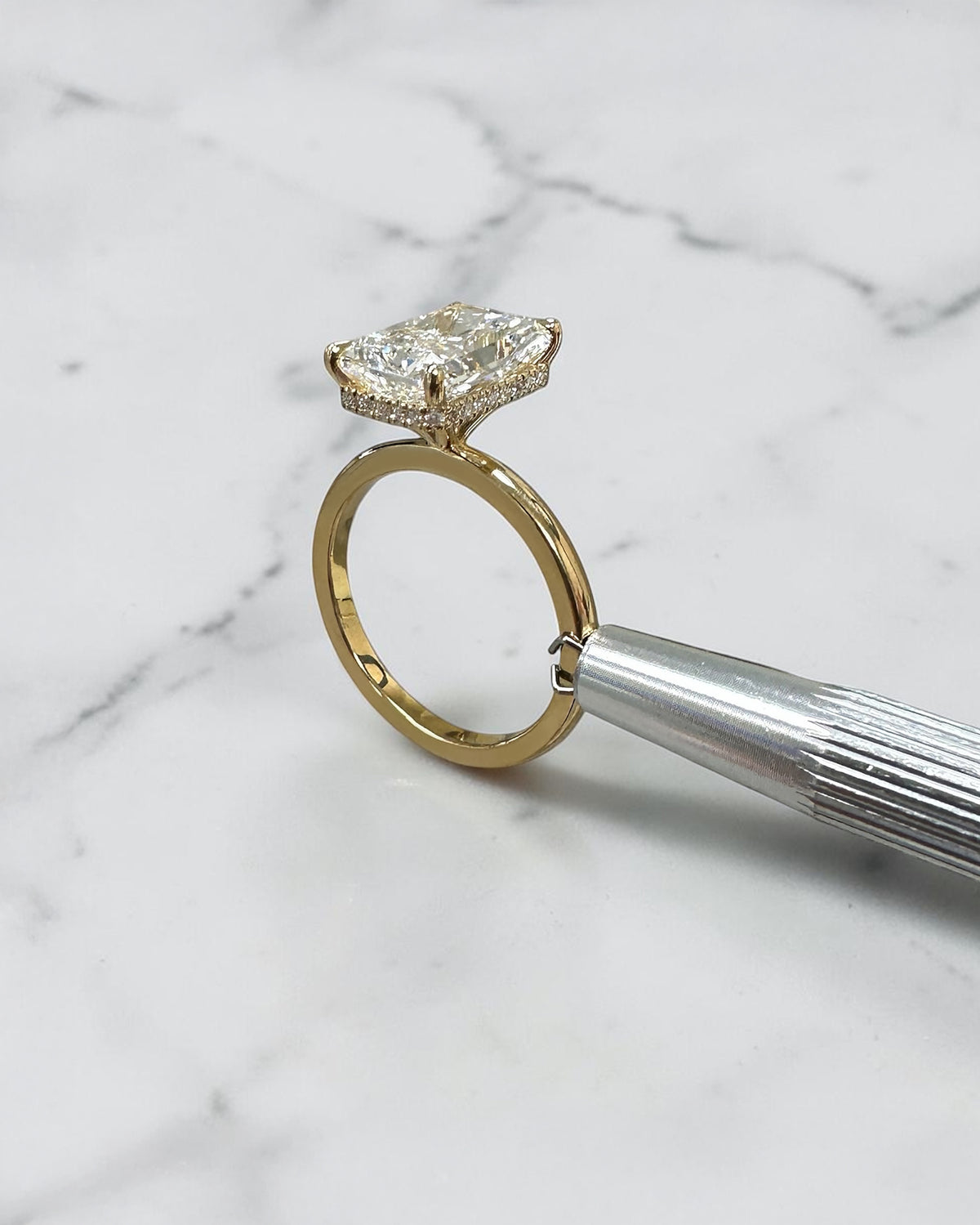 4ct radiant cut lab grown diamond engagement ring with floating setting and wrap around hidden halo 18kt yellow gold