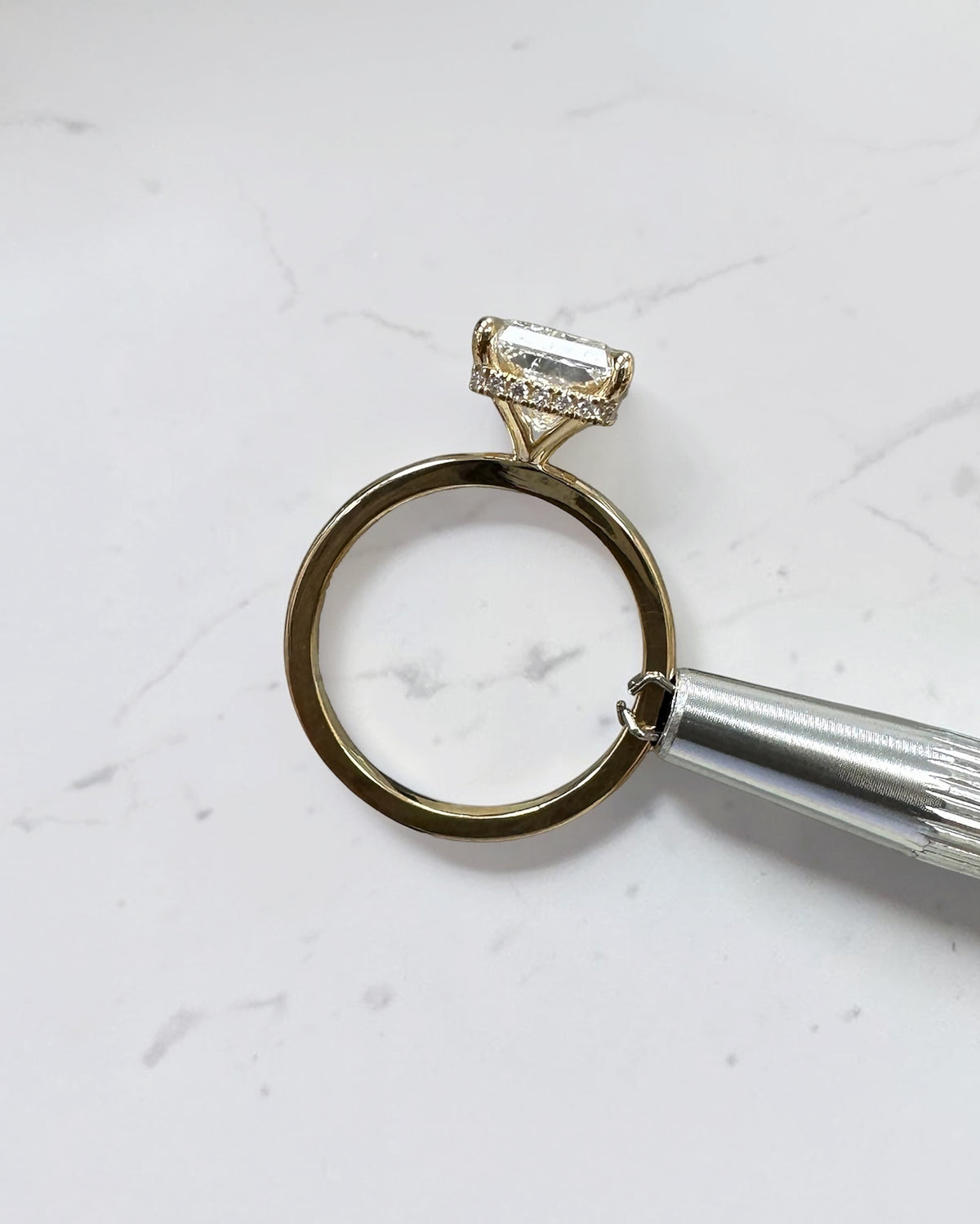 4ct radiant cut lab grown diamond engagement ring with floating setting and wrap around hidden halo 18kt yellow gold