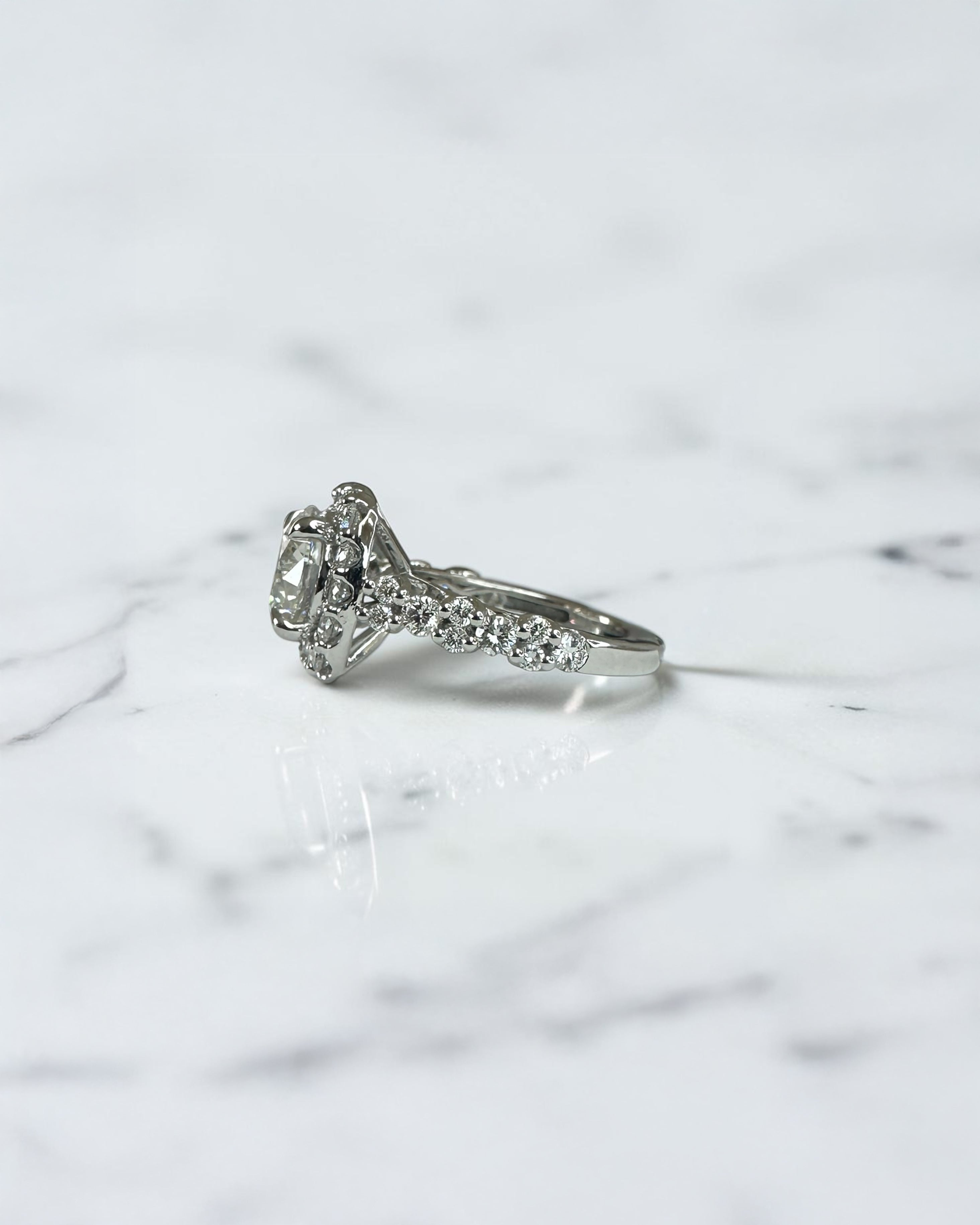 3ct round halo lab grown diamond engagement ring with diamond halo, fancy diamond shoulders and 4ct total diamond weight in 9ct yellow or white gold.