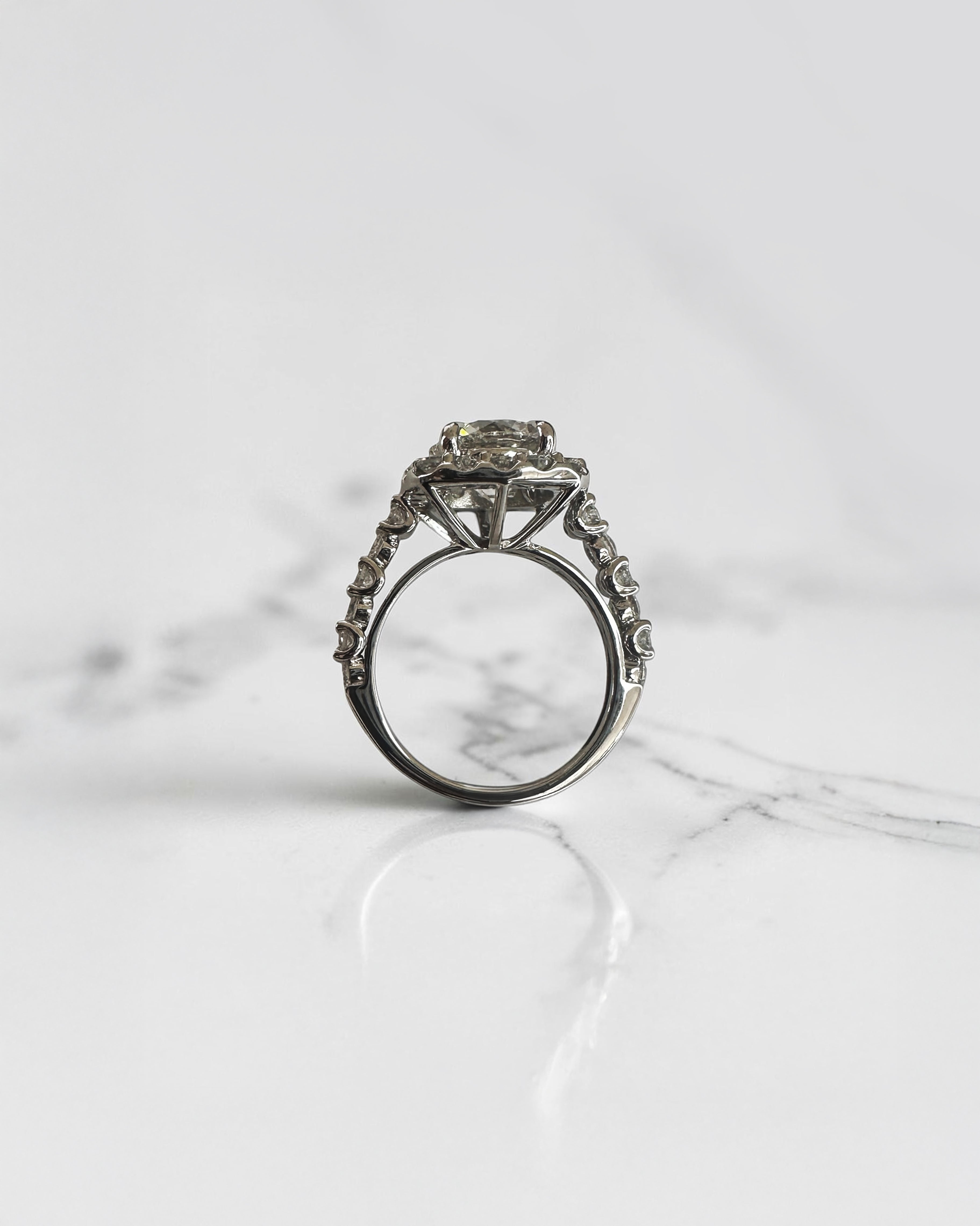 3ct round halo lab grown diamond engagement ring with diamond halo, fancy diamond shoulders and 4ct total diamond weight in 9ct yellow or white gold.
