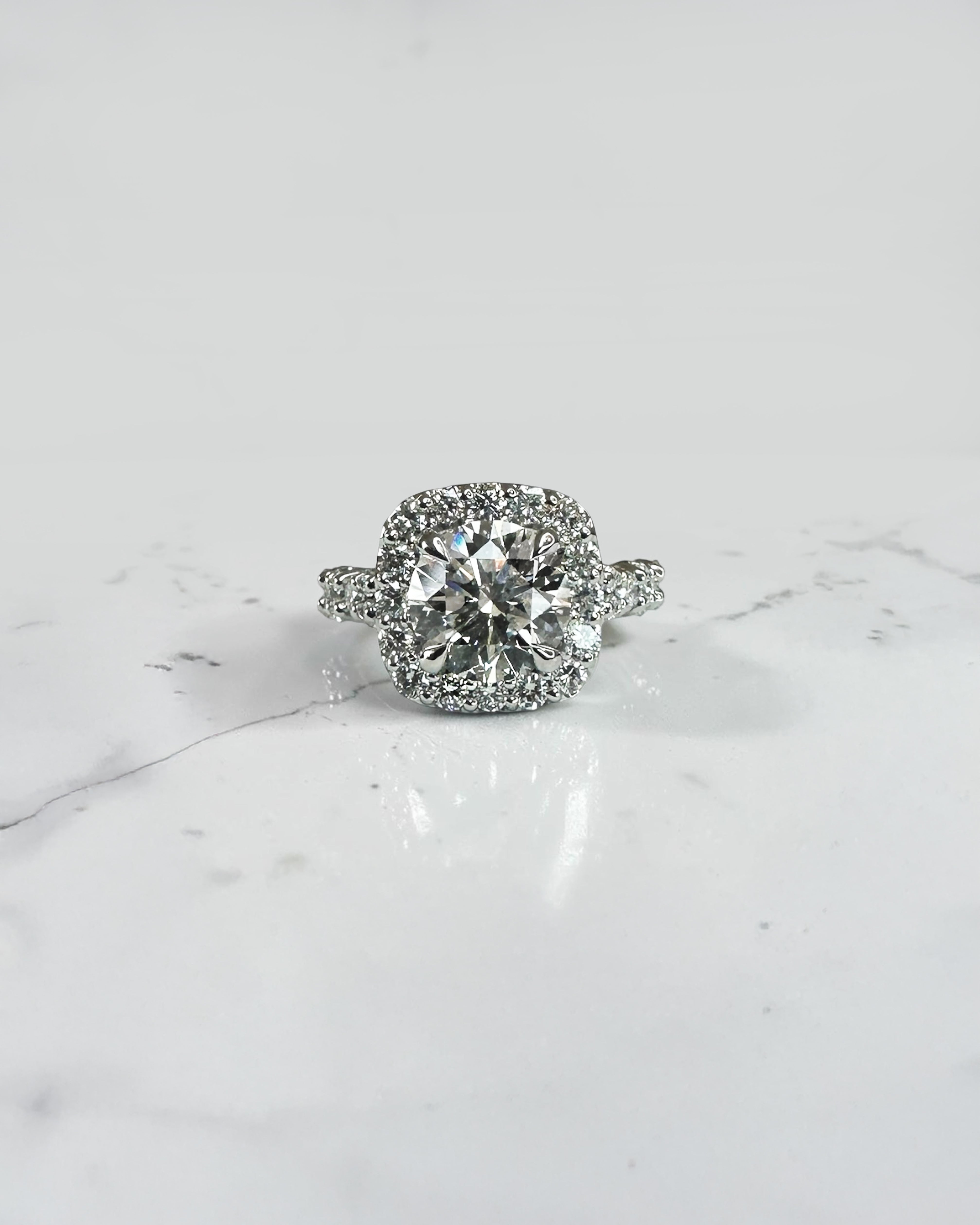 3ct round halo lab grown diamond engagement ring with diamond halo, fancy diamond shoulders and 4ct total diamond weight in 9ct yellow or white gold.