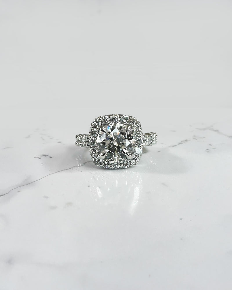 3ct round halo lab grown diamond engagement ring with diamond halo, fancy diamond shoulders and 4ct total diamond weight in 9ct yellow or white gold.