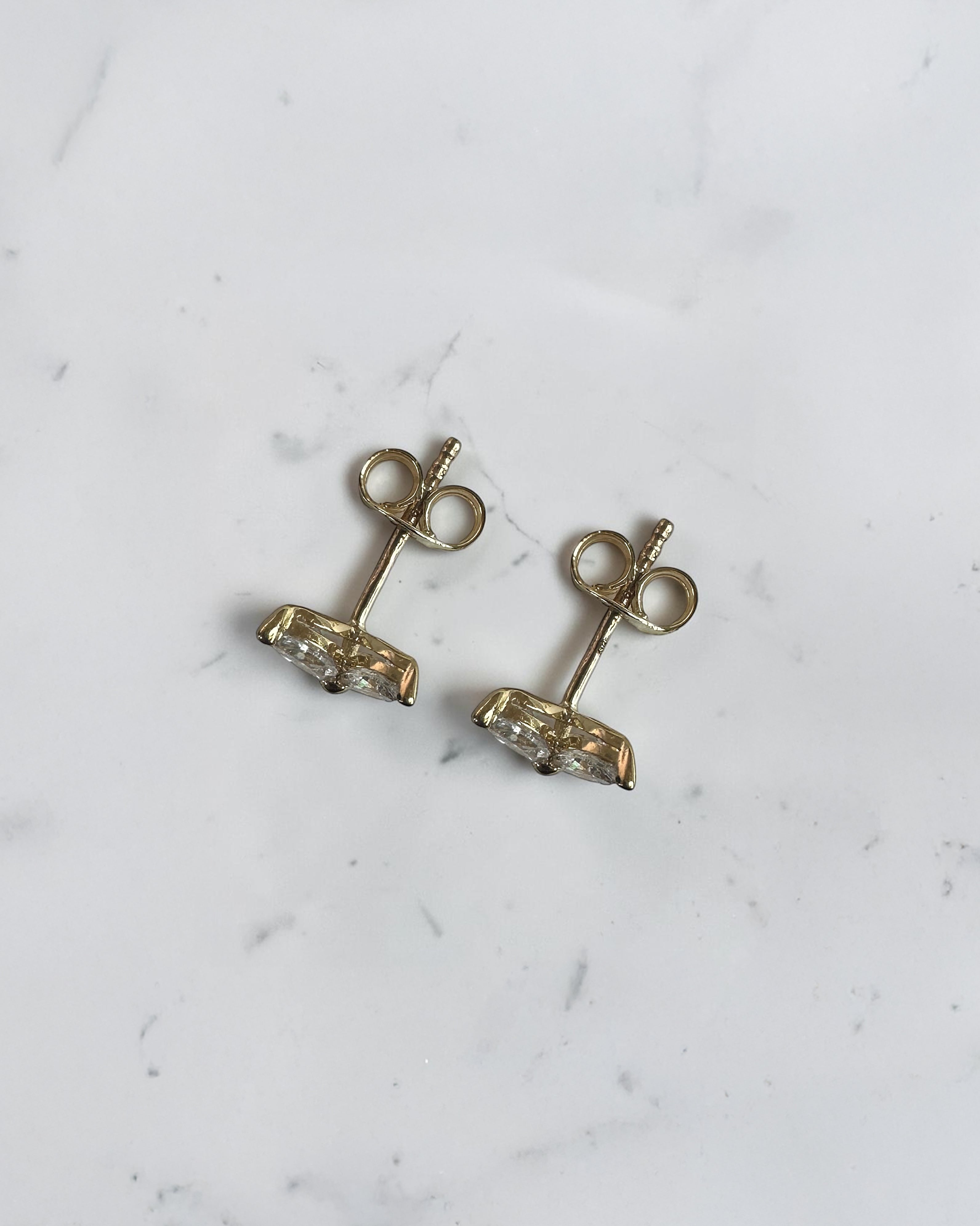 1.40ct marquise diamond flower stud earrings in yellow gold featuring four marquise cut diamonds per earring, available in lab grown or natural diamonds.